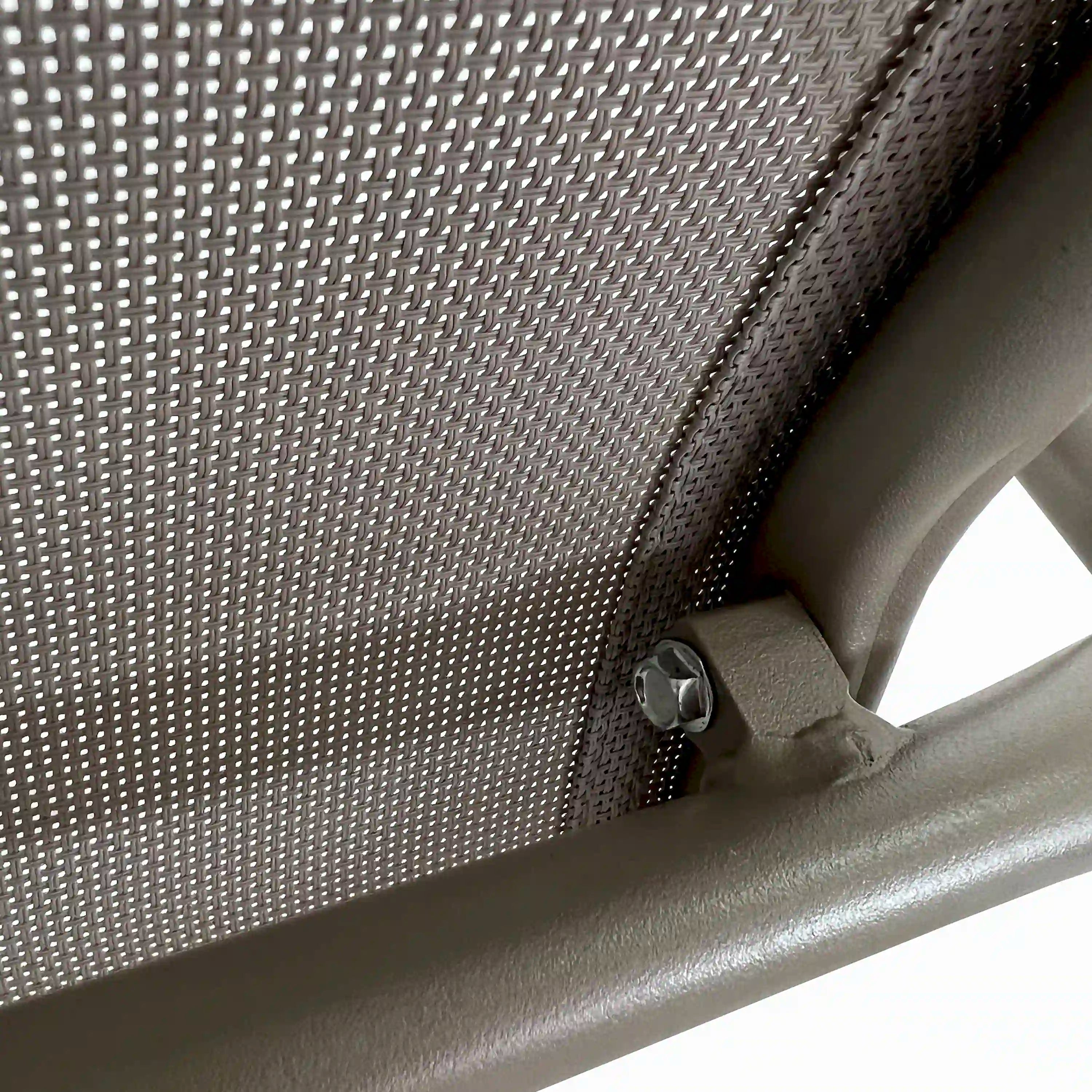 Champagne outdoor dining chair corner joint with woven mesh and metal fasteners