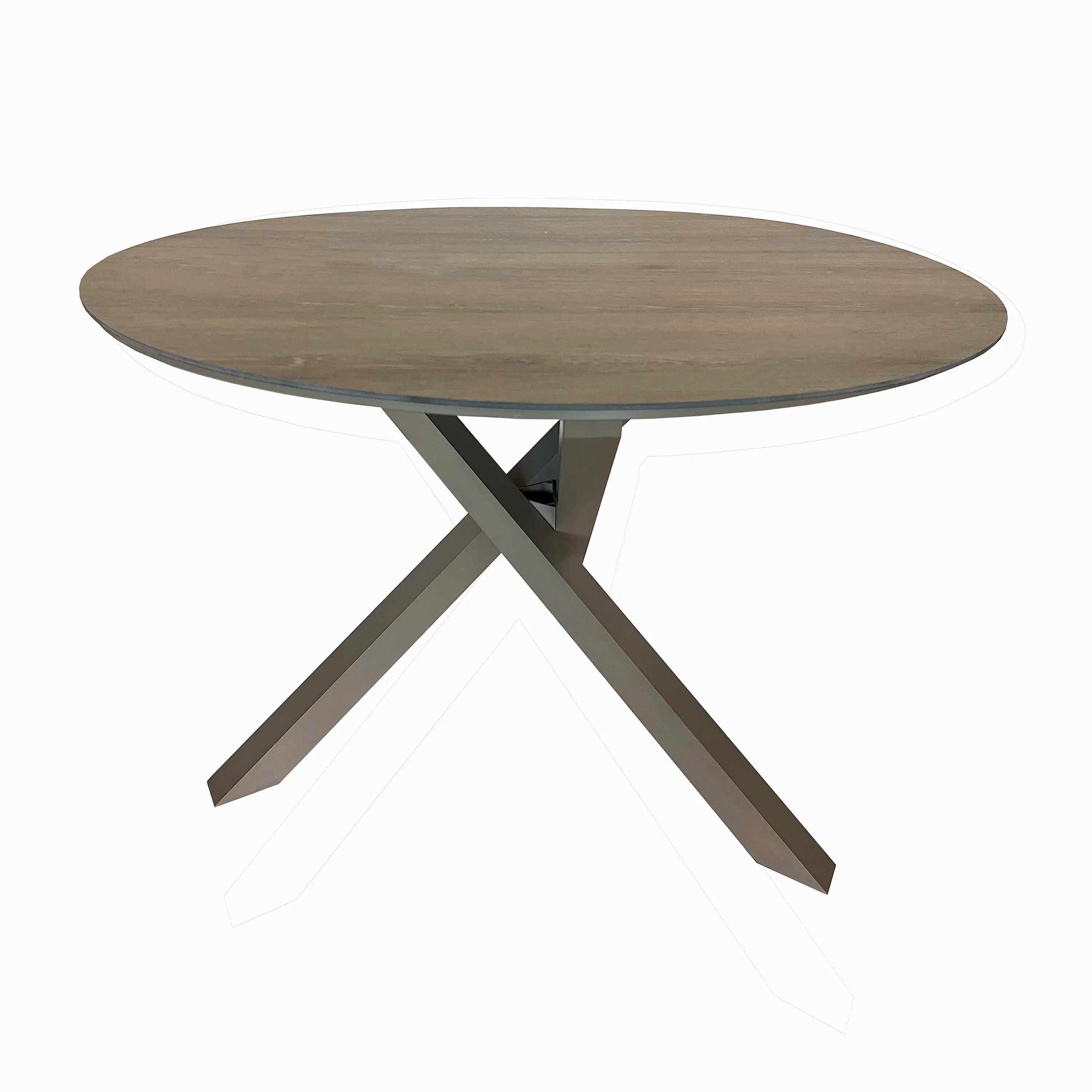 Round outdoor dining table with wood-look top and champagne metal X base