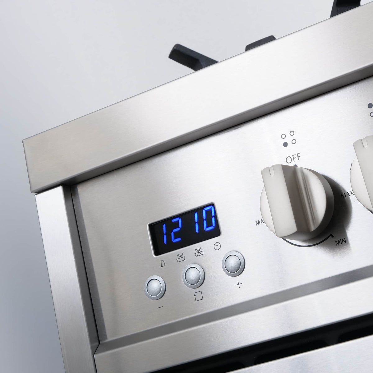Stainless steel gas range control panel with digital display and rotary knobs