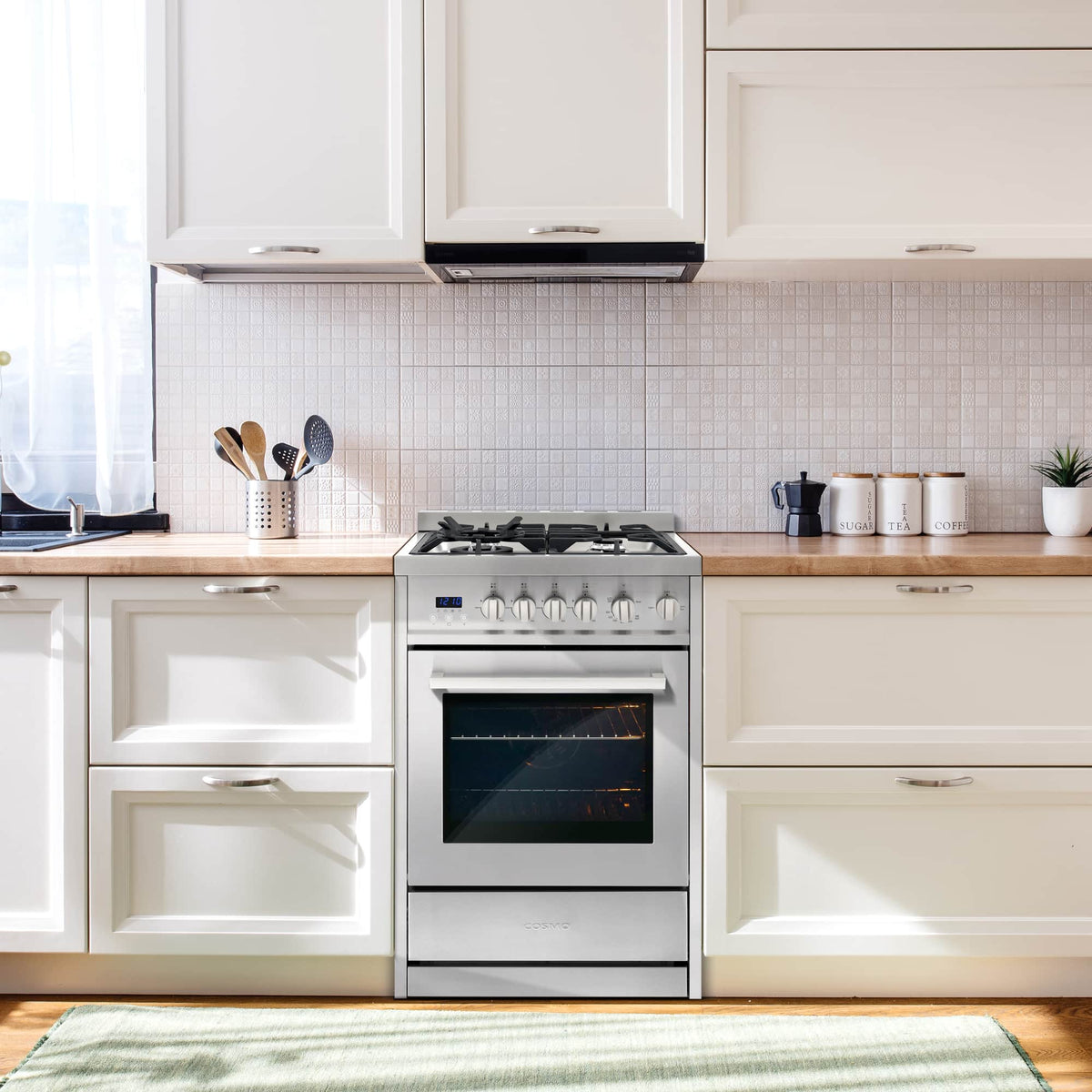 Stainless steel freestanding gas range with four-burner cooktop and closed oven