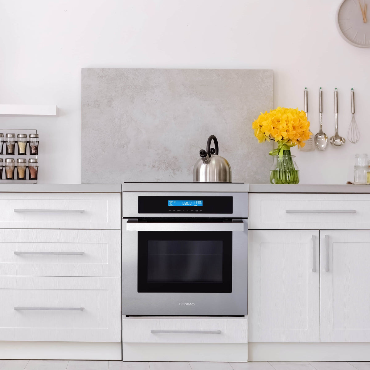 Stainless steel wall oven with black glass door and front control panel