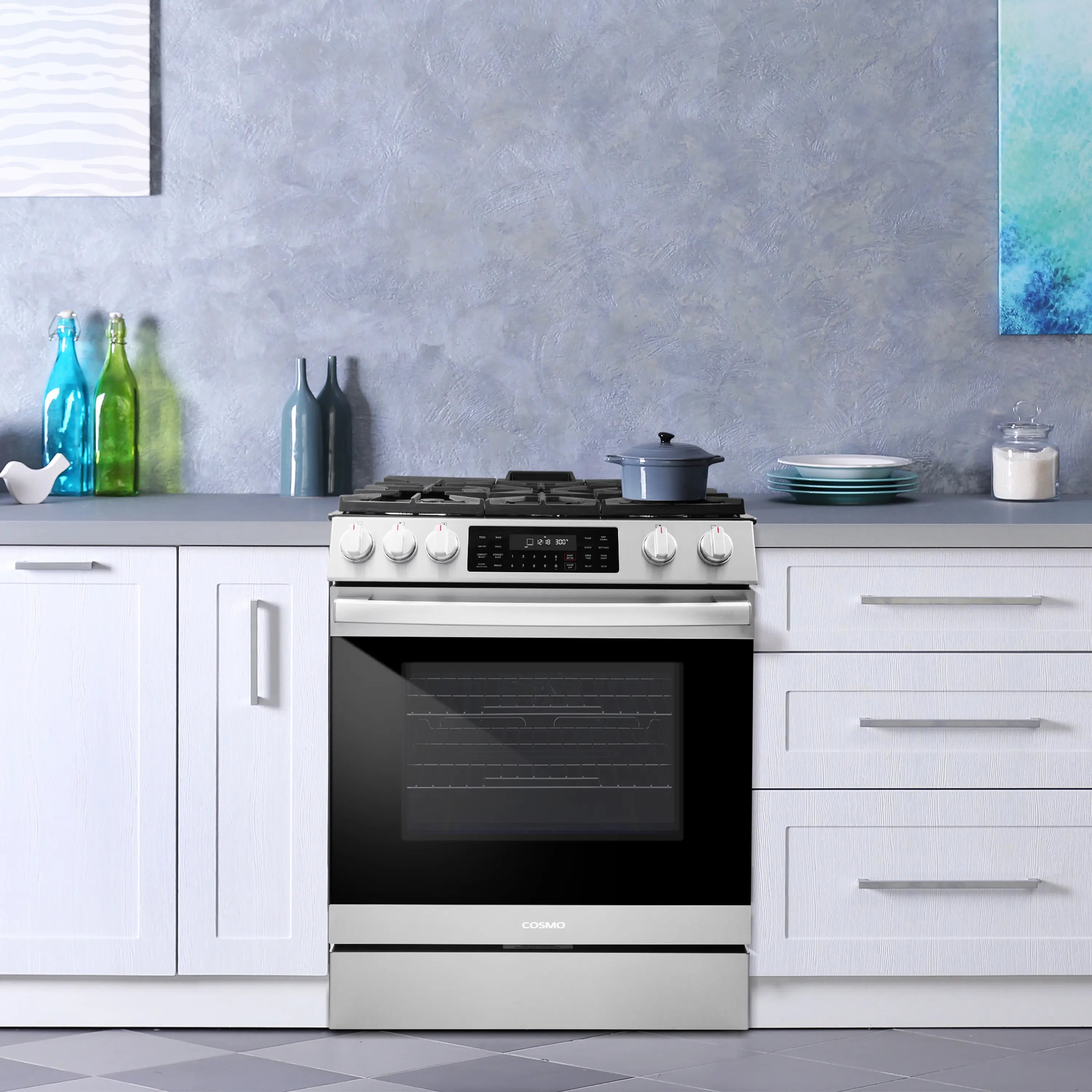 Stainless steel gas range with closed convection oven door and five-burner cooktop