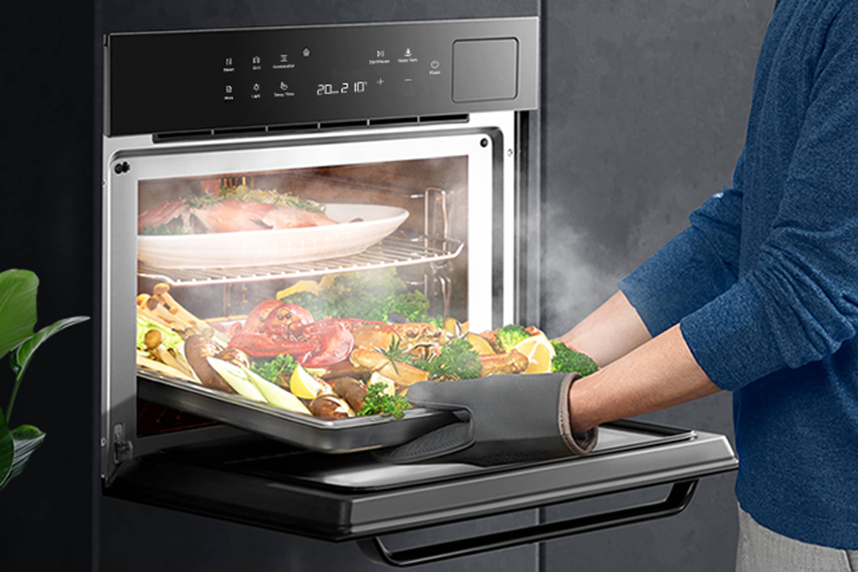 Built-in steam oven with open door, visible food, and metal cooking racks