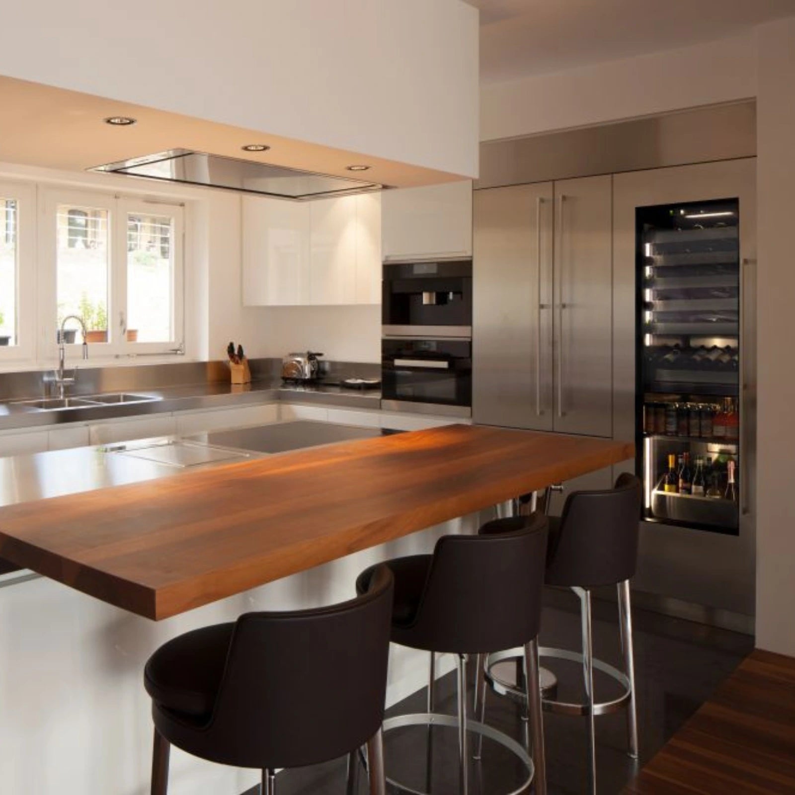 Stainless dual-zone under-counter beverage center with glass door and interior shelves