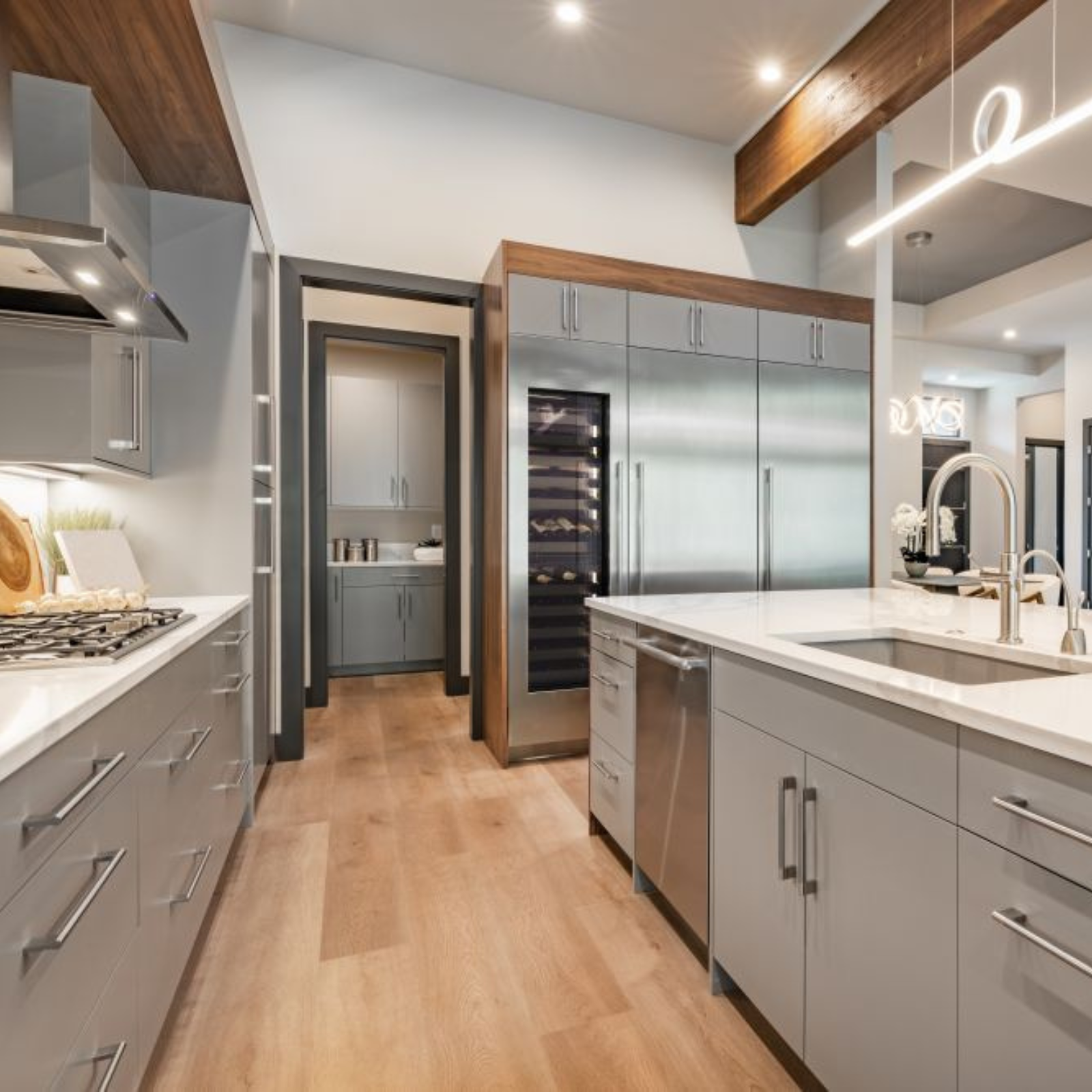 Built-in stainless steel dual-zone wine cooler installed in modern kitchen