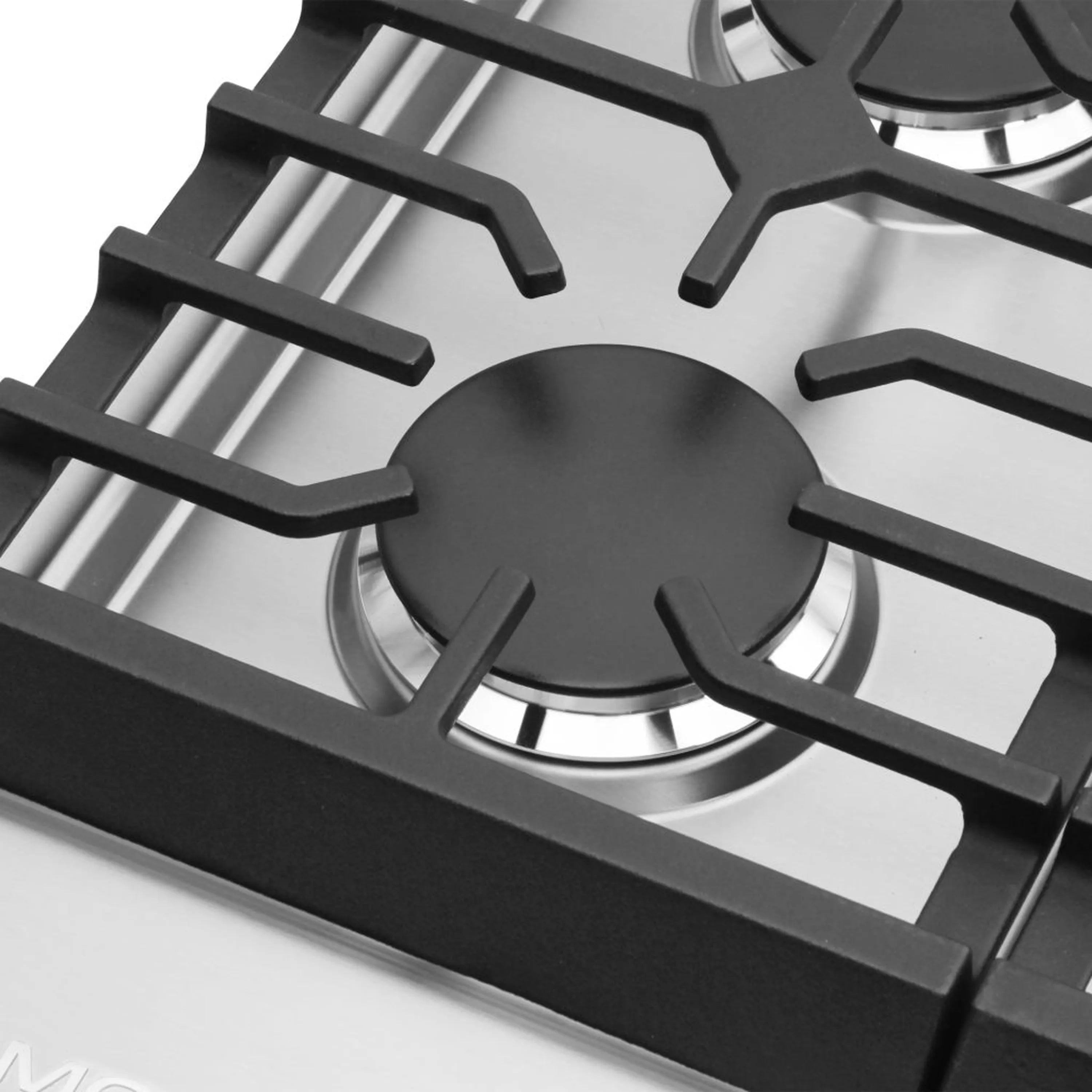 Stainless steel gas cooktop with black grates and flame-ring burners close-up