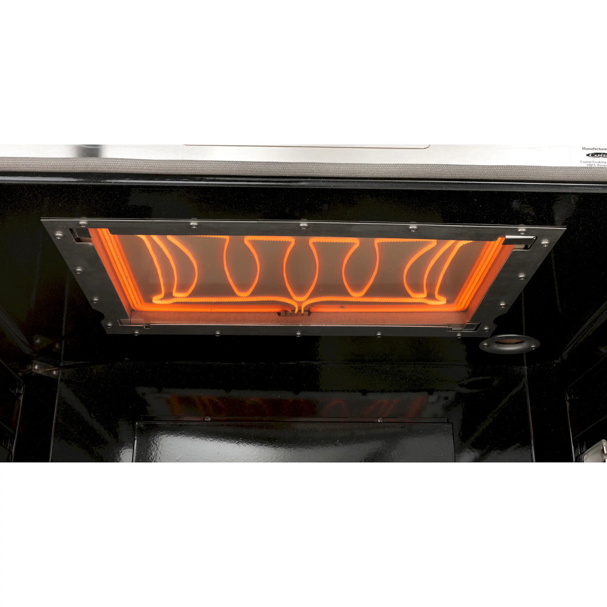 Gas range griddle burner area with glowing orange flames