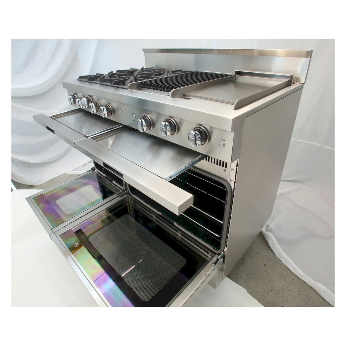 Stainless steel chef gas range with open oven door and griddle cooking surface