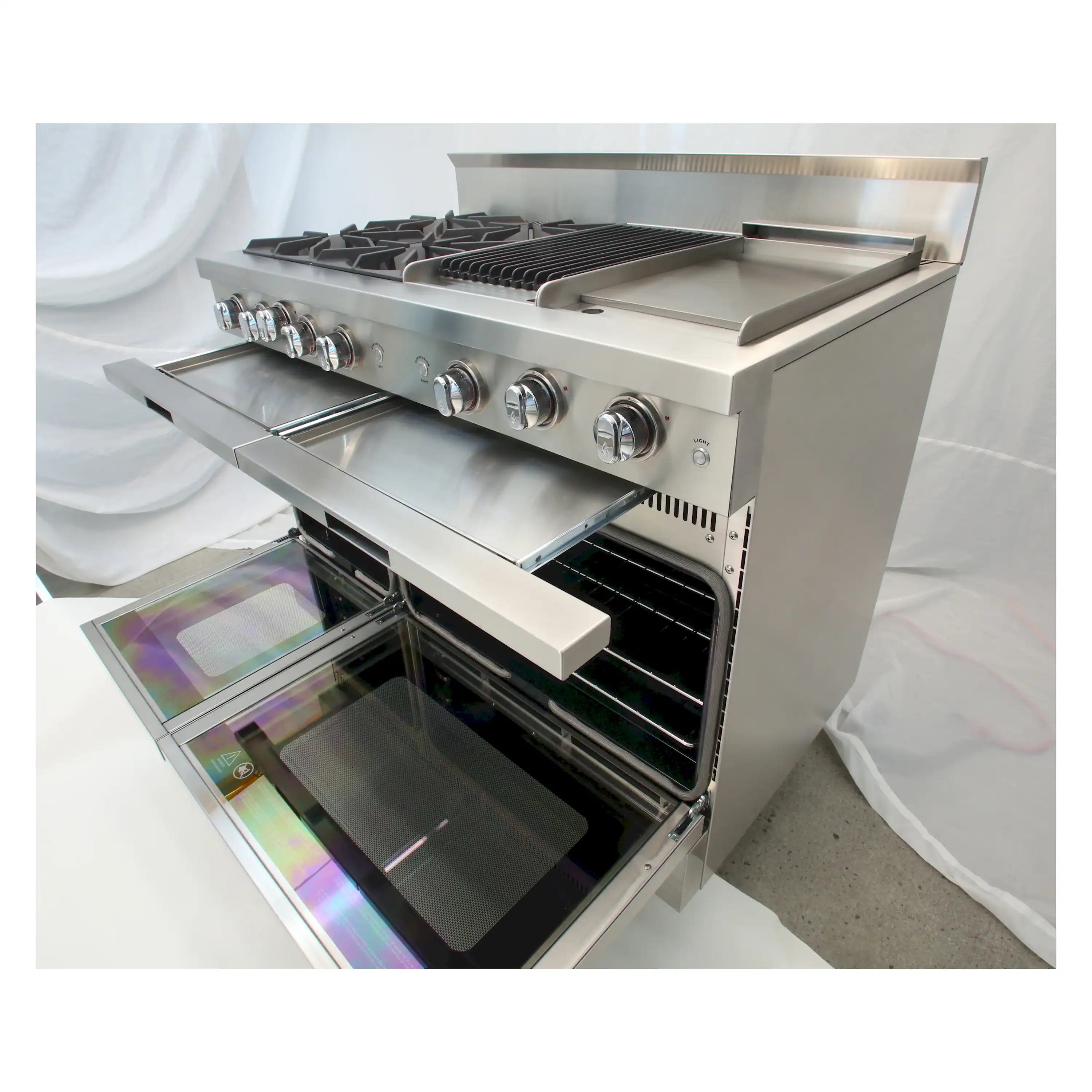 Stainless steel gas chef range with open oven door and griddle surface