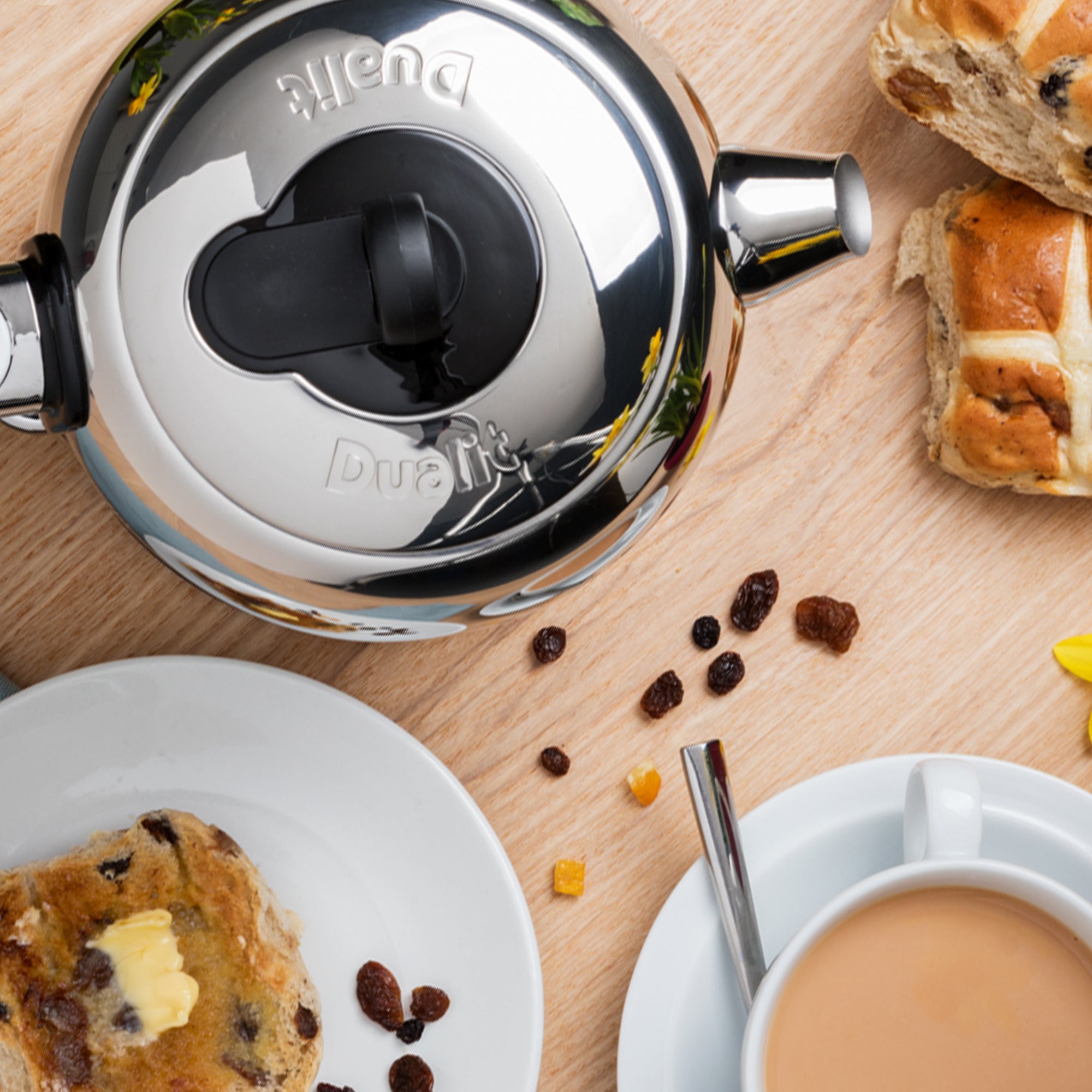 Top view of polished chrome electric kettle with lid knob and circular base label.