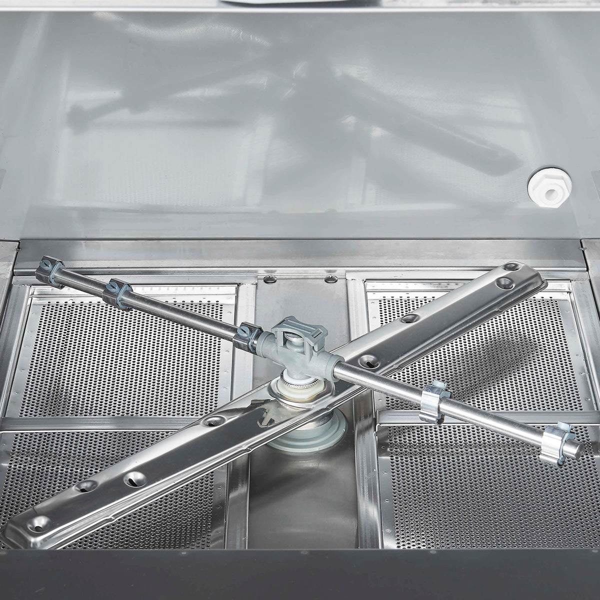Stainless steel undercounter dishwasher spray arm and wash area