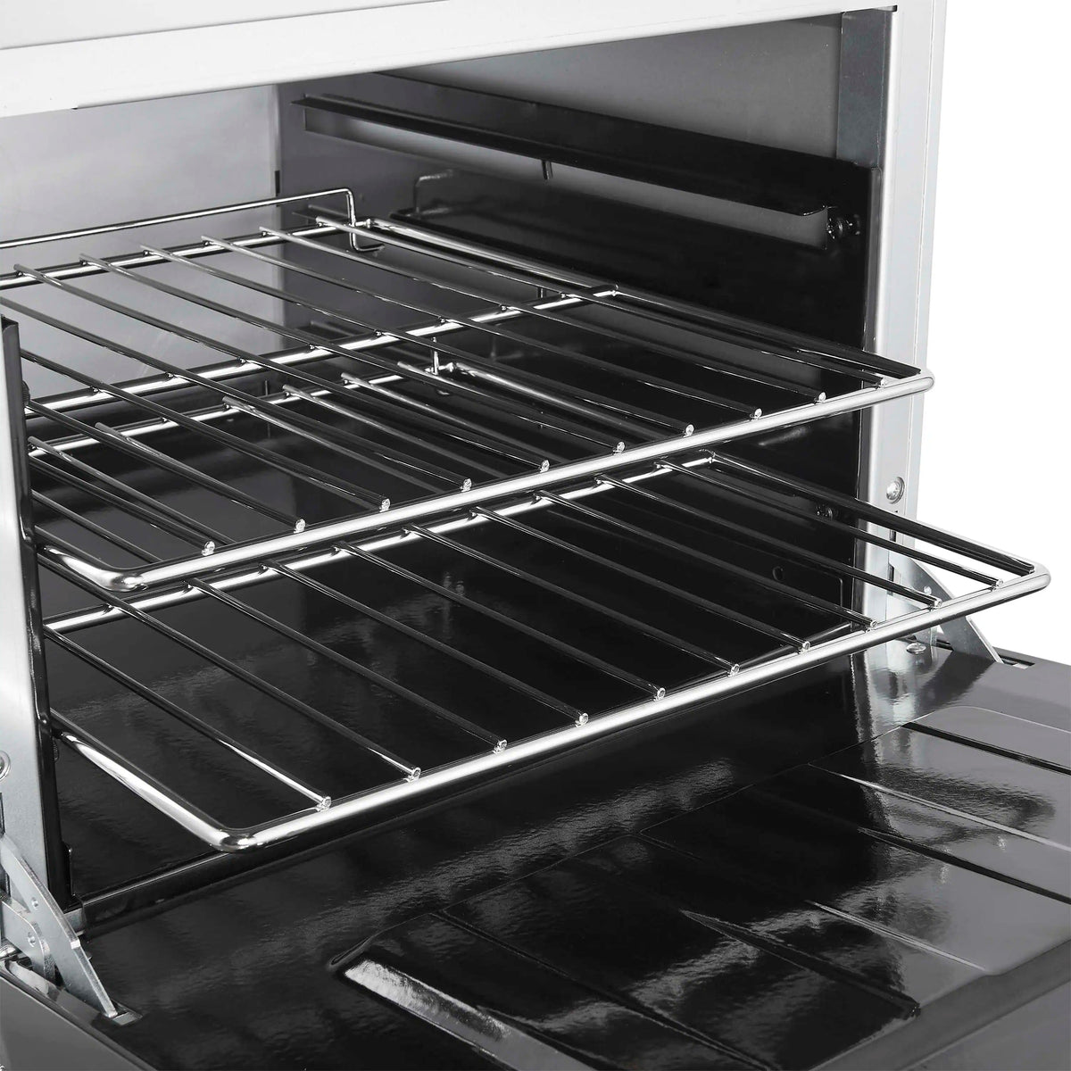 Stainless oven interior with two cooking racks and black oven floor