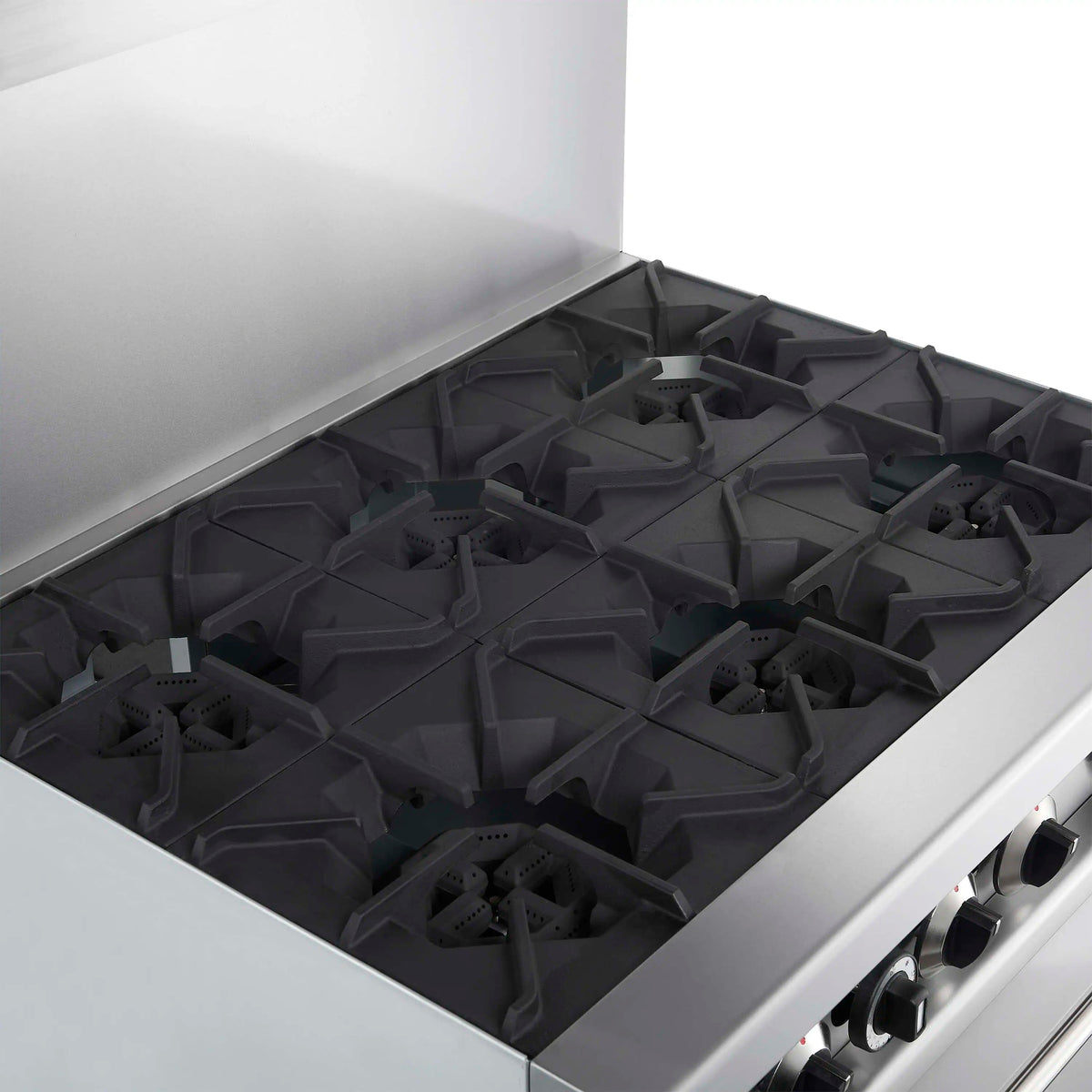 Stainless steel gas range cooktop with six black burner grates, hood open