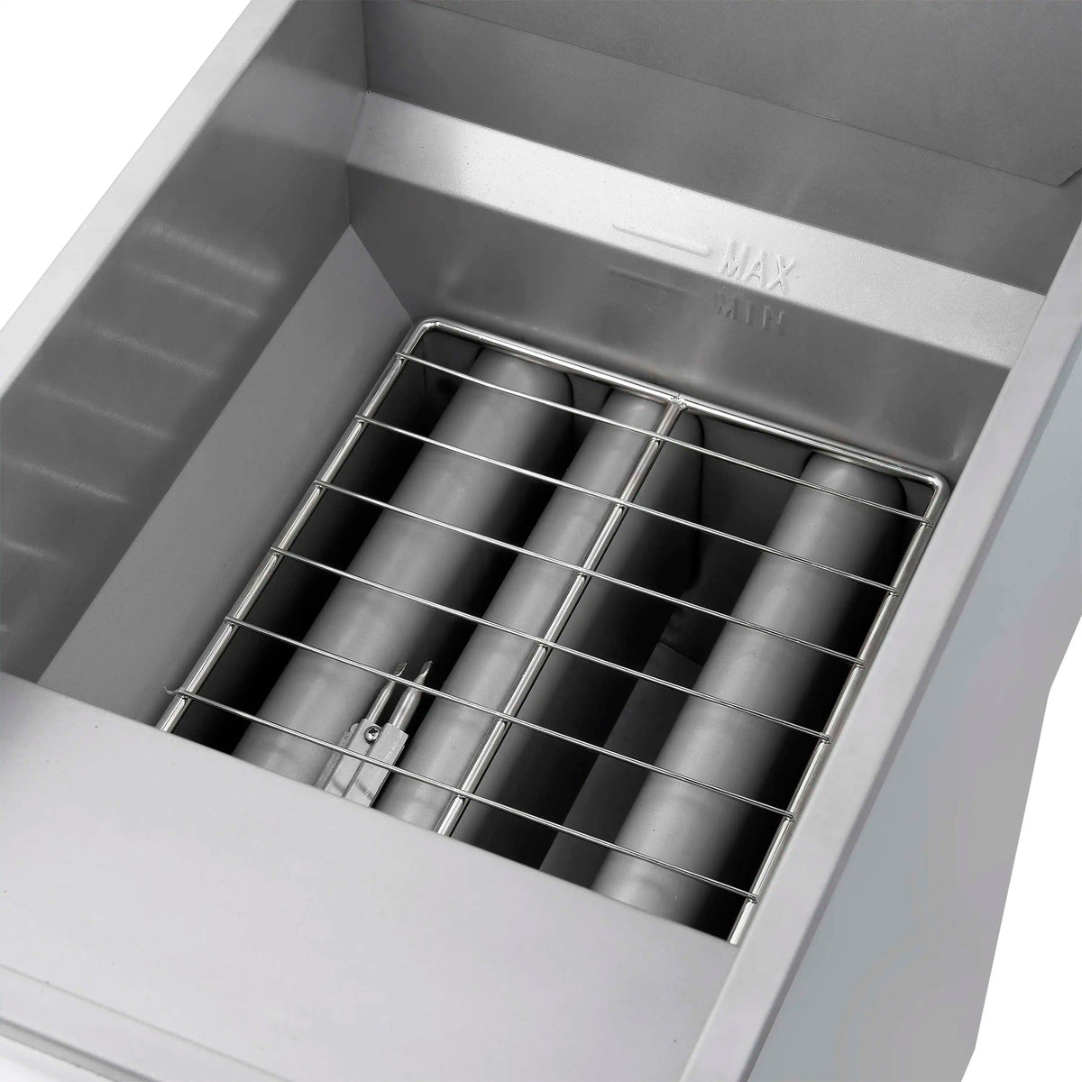 Deep fryer oil tank with wire basket insert and black fryer oil inside
