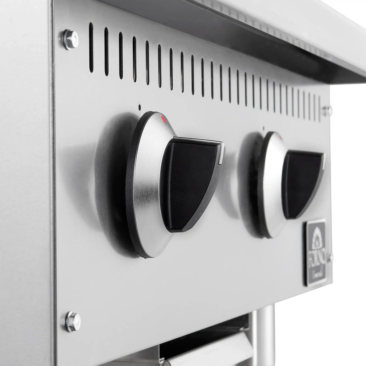 Stainless steel gas griddle close-up of two control knobs with vent strip above