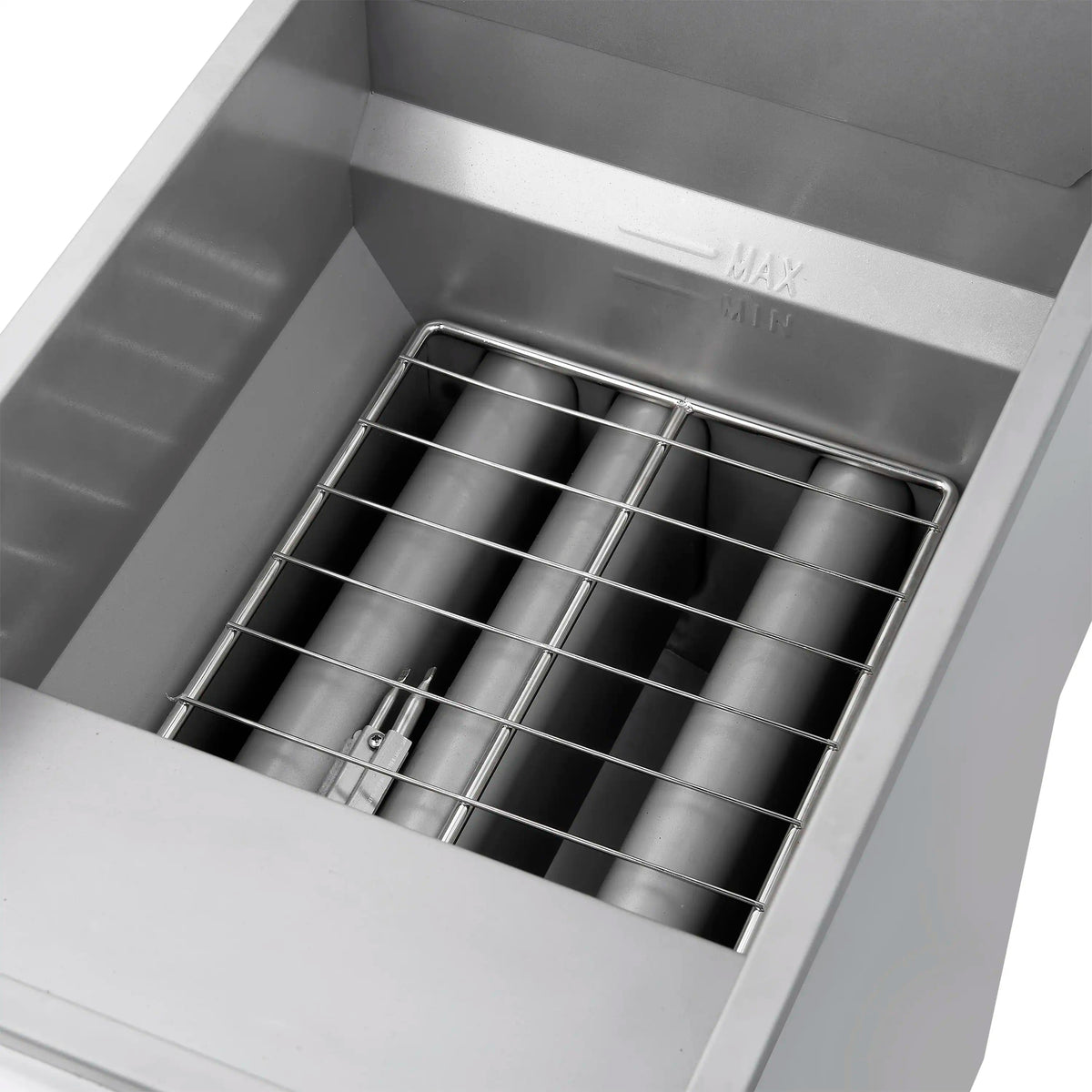 Stainless steel fry tank with two wire baskets inside a commercial deep fryer
