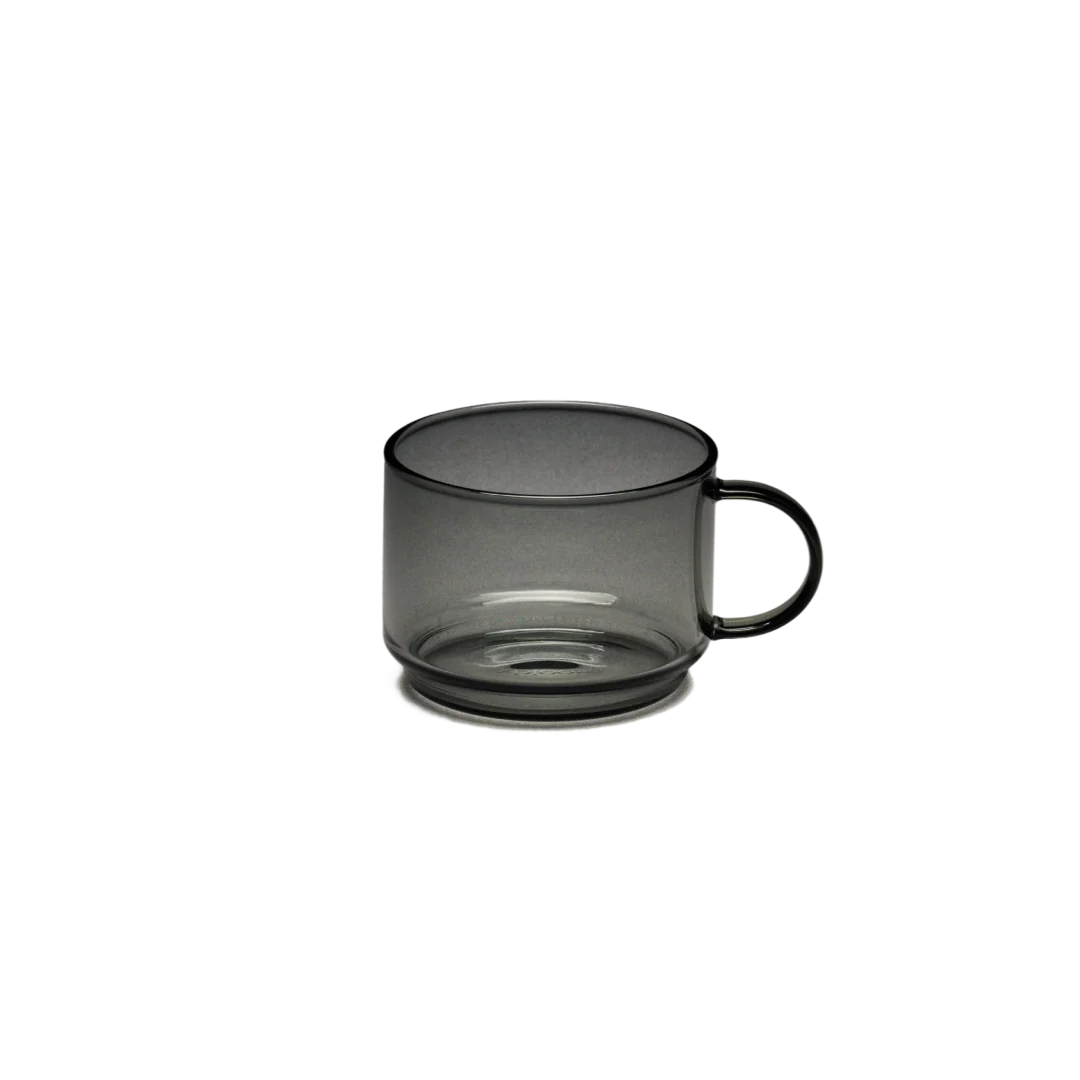 xBloom Infinity tasting cup, clear glass with black handle and dark outer body