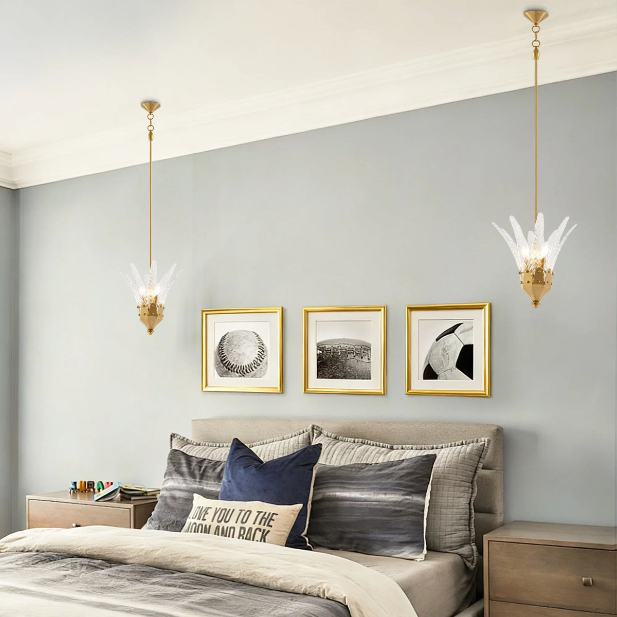 Feather-shaped island pendant light with white feather cluster and golden hanging chain