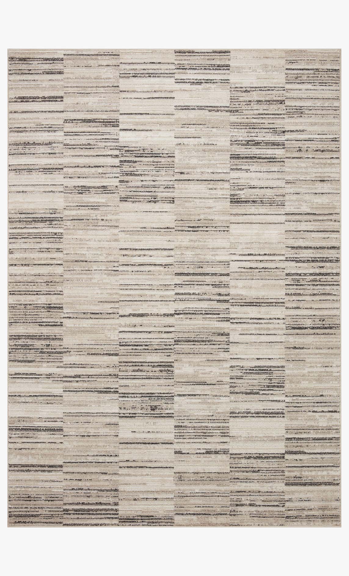 Charcoal and sand area rug with multicolor patchwork blocks and horizontal stripes.