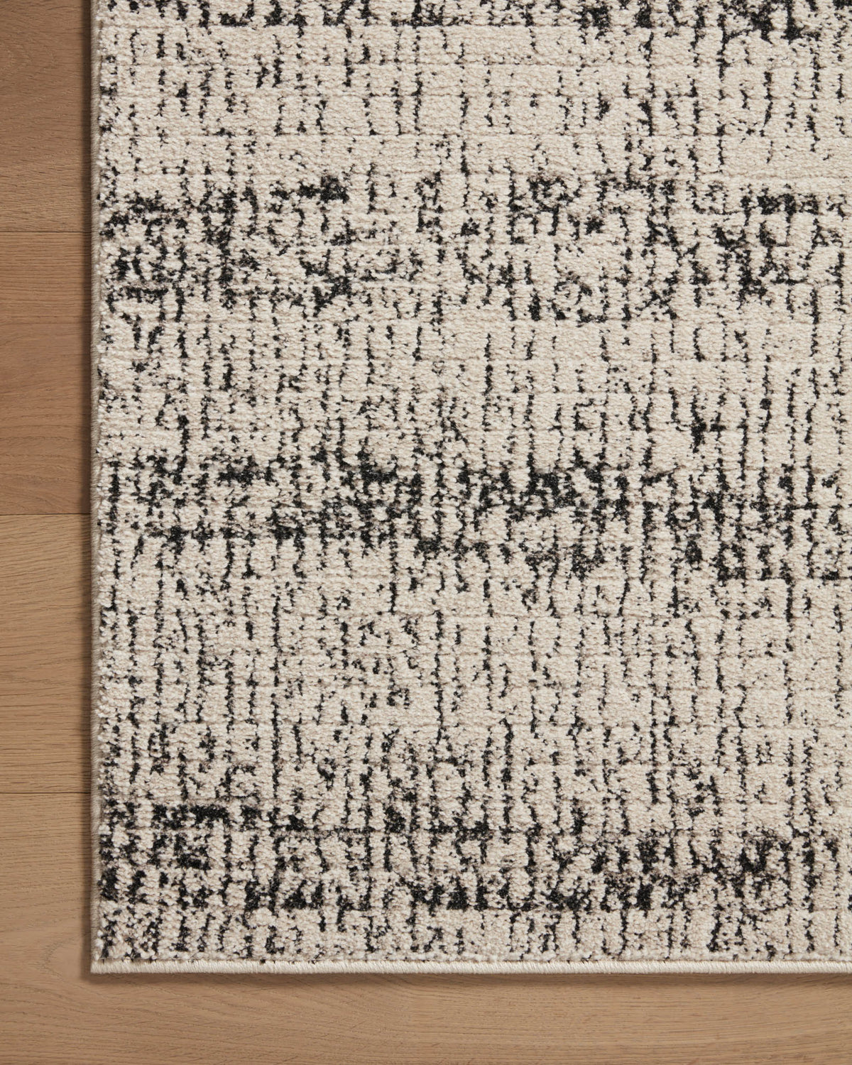 Oatmeal and charcoal area rug rectangle view with distressed abstract pattern