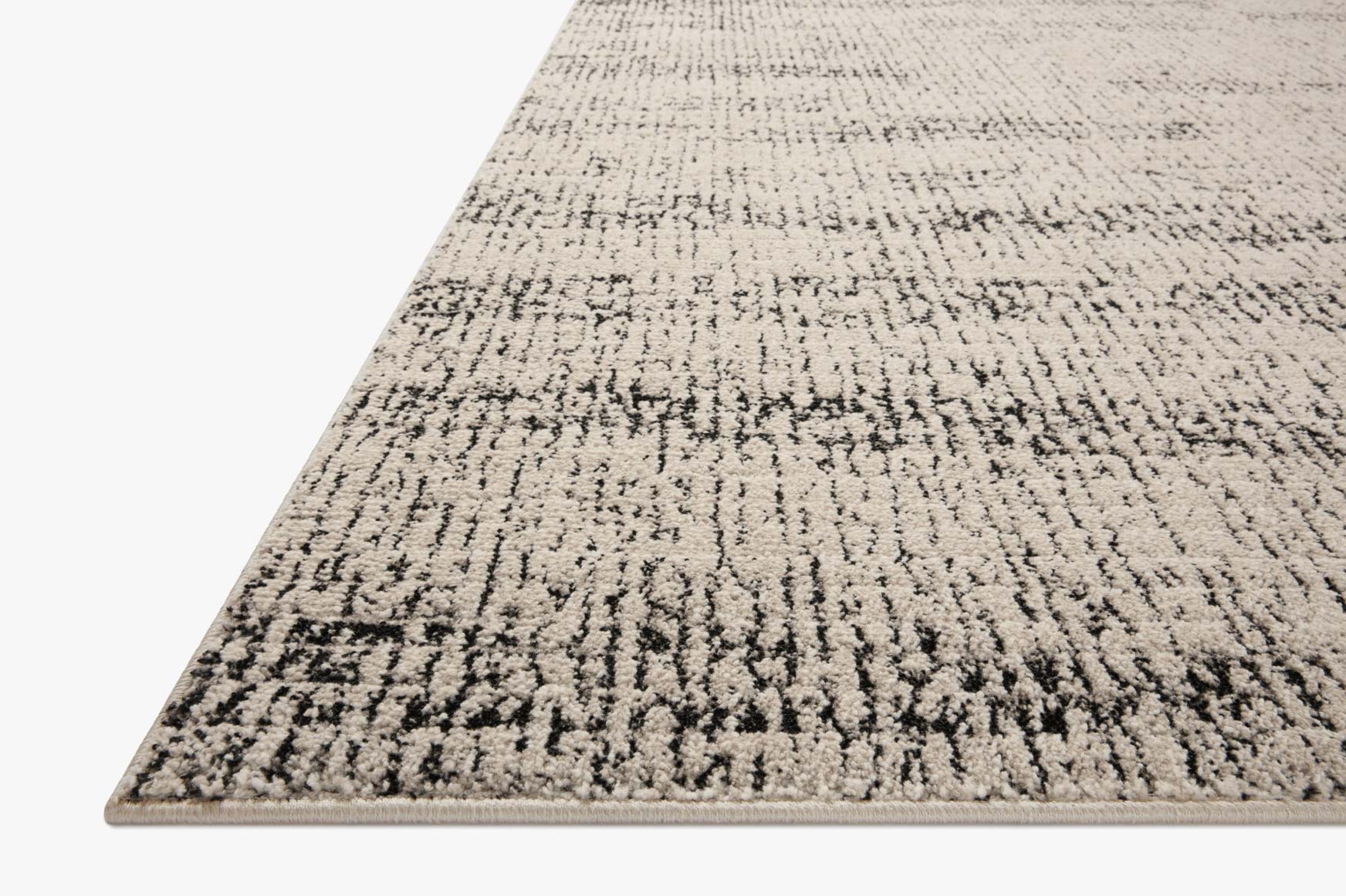 Oatmeal and charcoal runner rug with distressed, textured abstract pattern