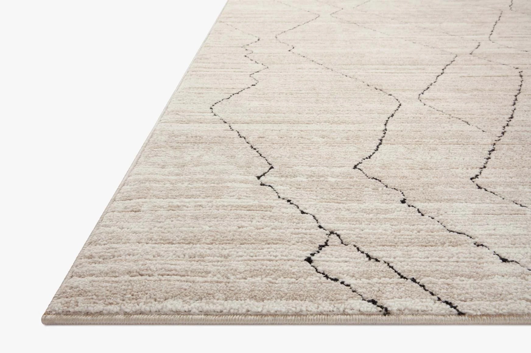 Sand and charcoal geometric area rug with low pile and zigzag diamond pattern