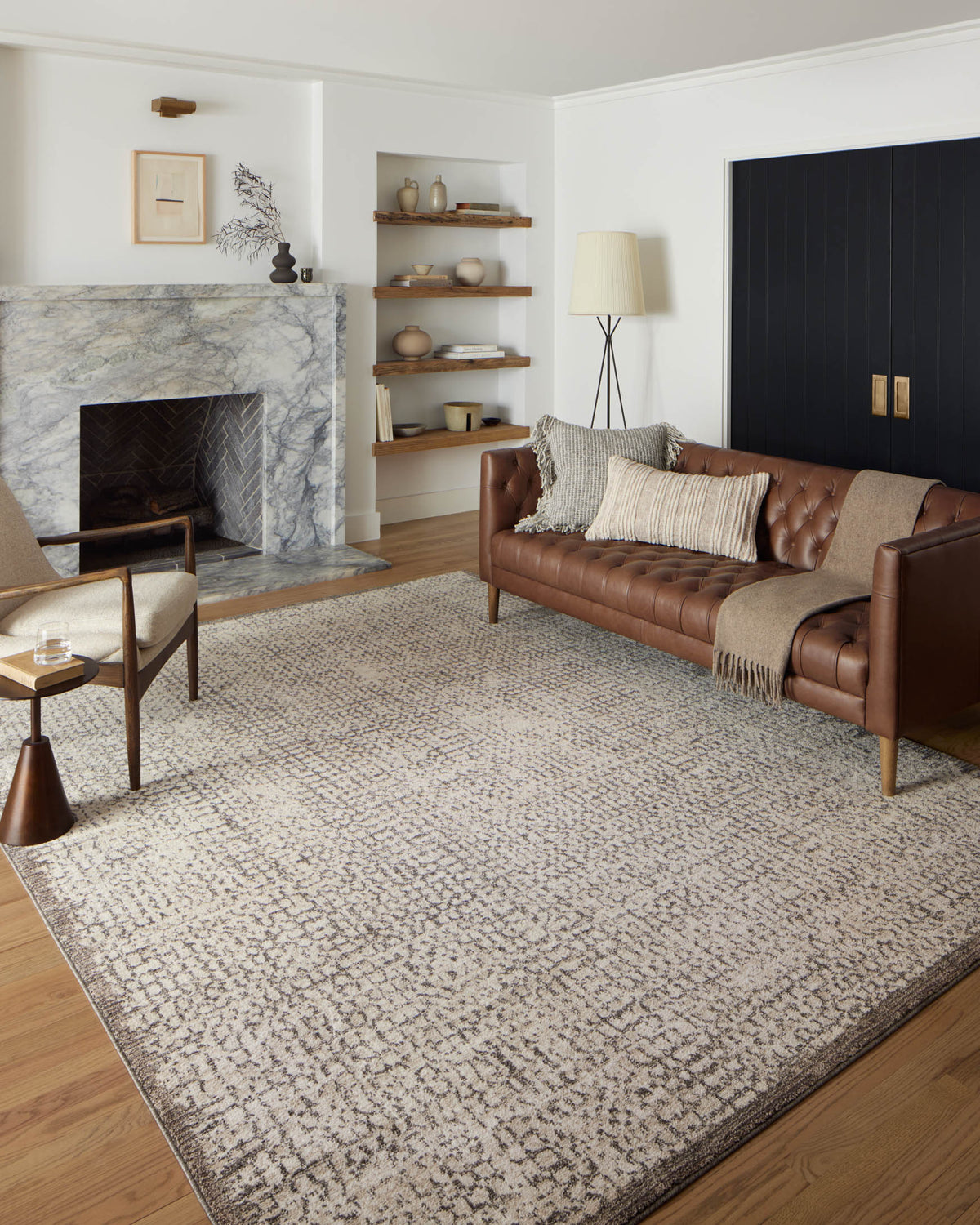 Ivory and stone area rug with distressed abstract pattern and low-pile texture