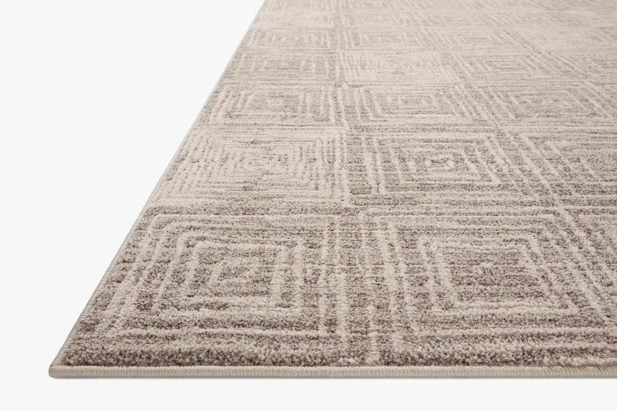 Beige and gray area rug with geometric maze pattern, flat weave.
