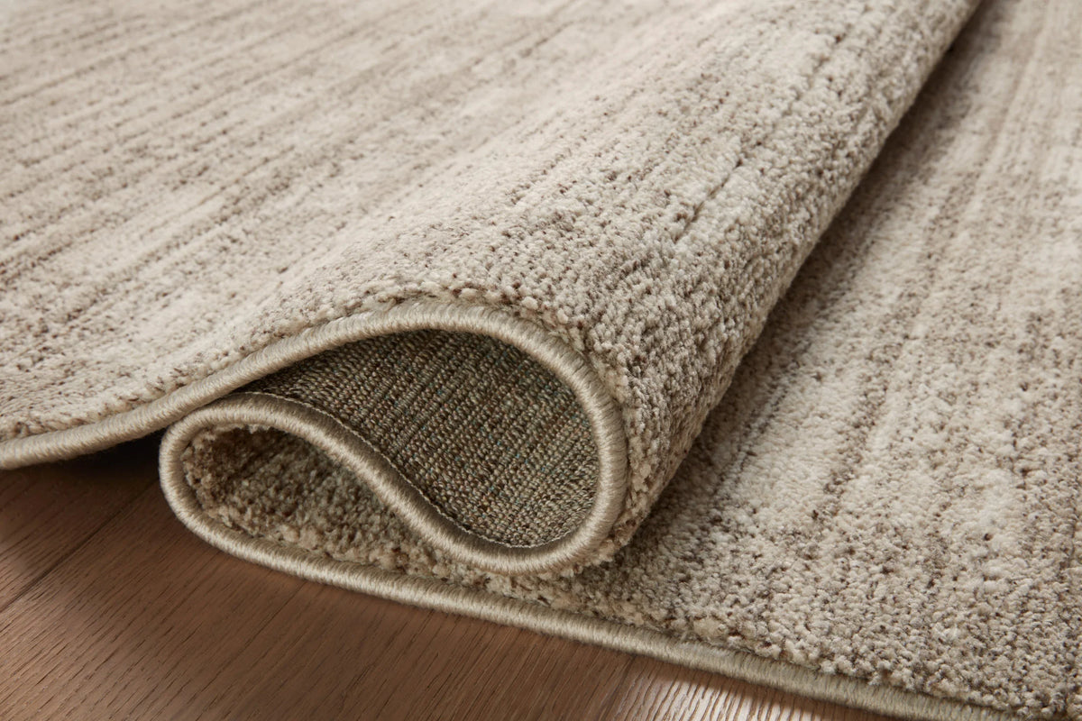 Pebble and sand runner rug rolled edge detail with textured low pile and stitched border