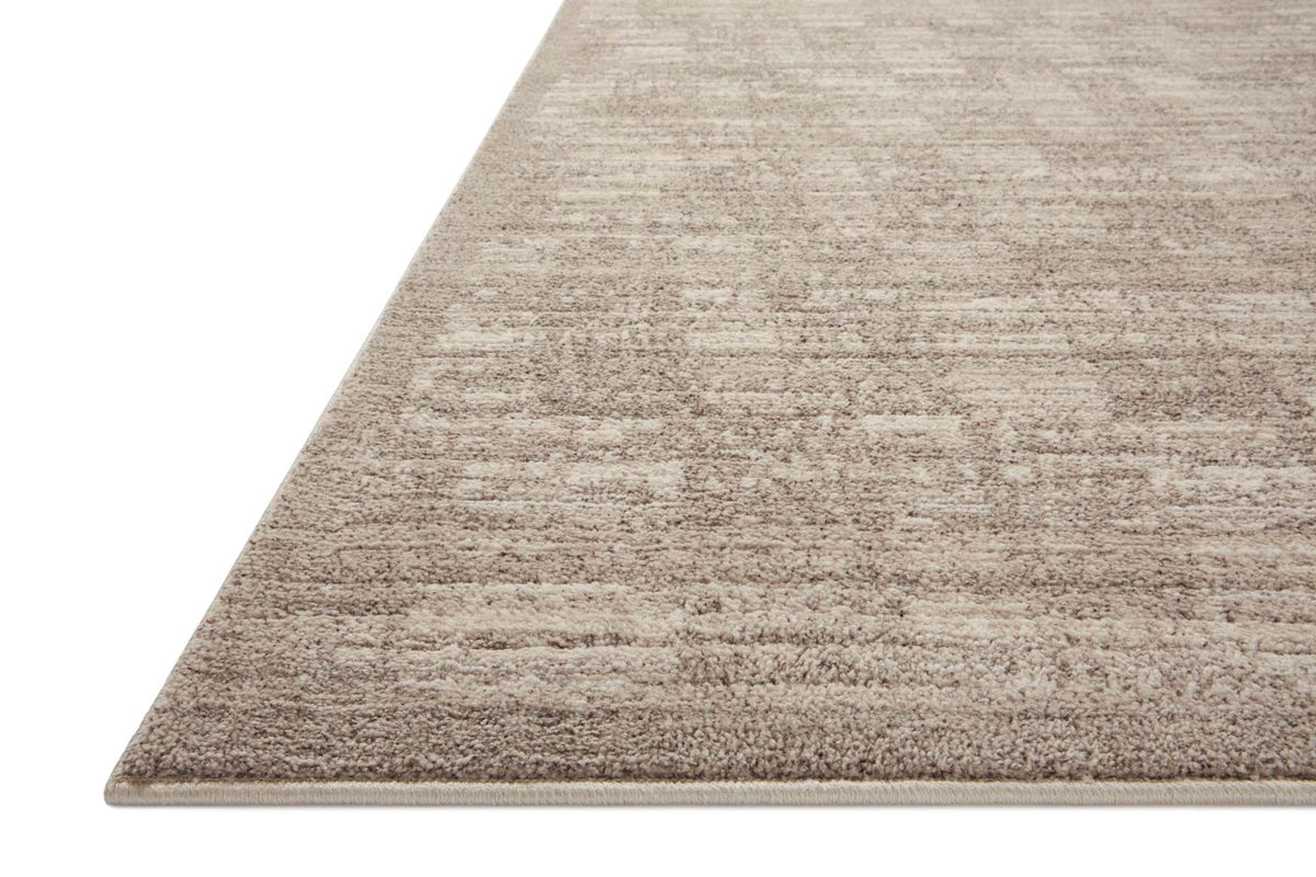 Beige and gray area rug with textured striped pattern and flat woven edge.