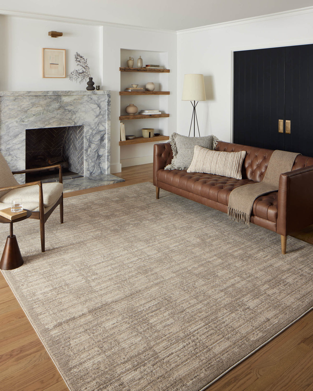 Beige and gray area rug with abstract horizontal stripes, laid flat.