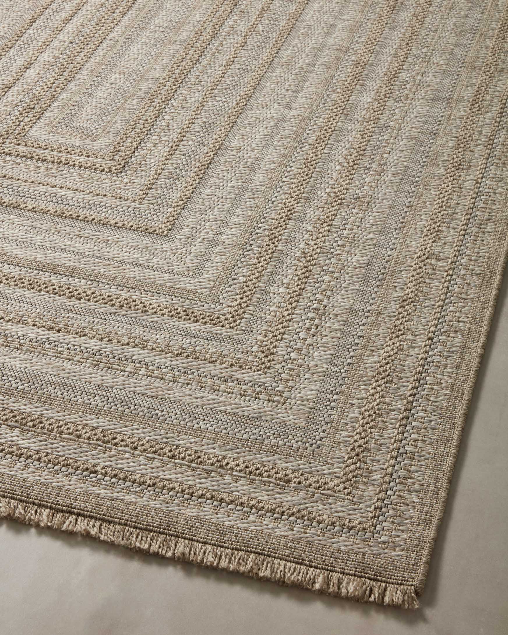 Natural area rug flat weave with stacked geometric squares and fringed edge