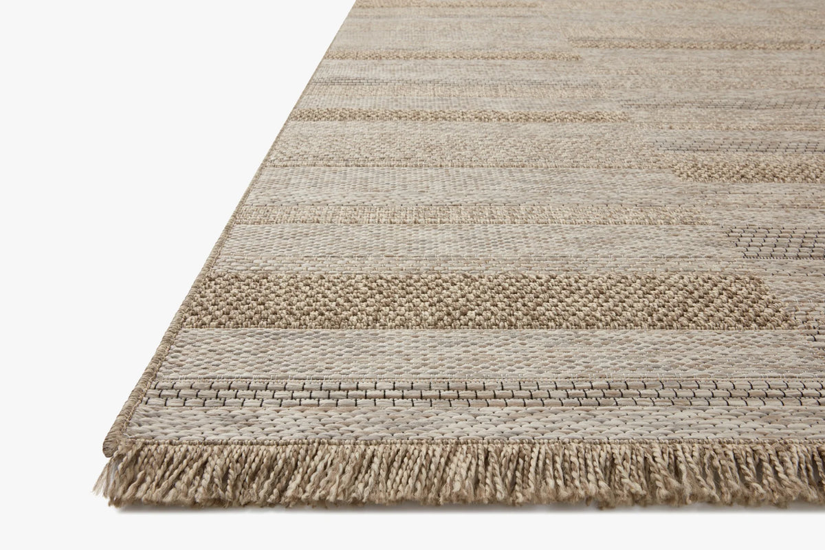Loloi II natural area rug with layered stripe pattern and short fringe edge