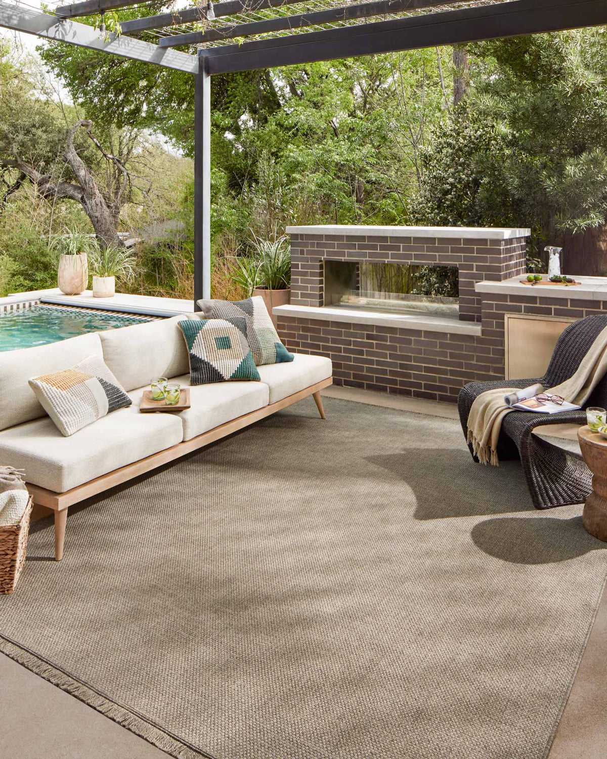 Natural runner rug with textured surface and subtle fringe, laid outdoors