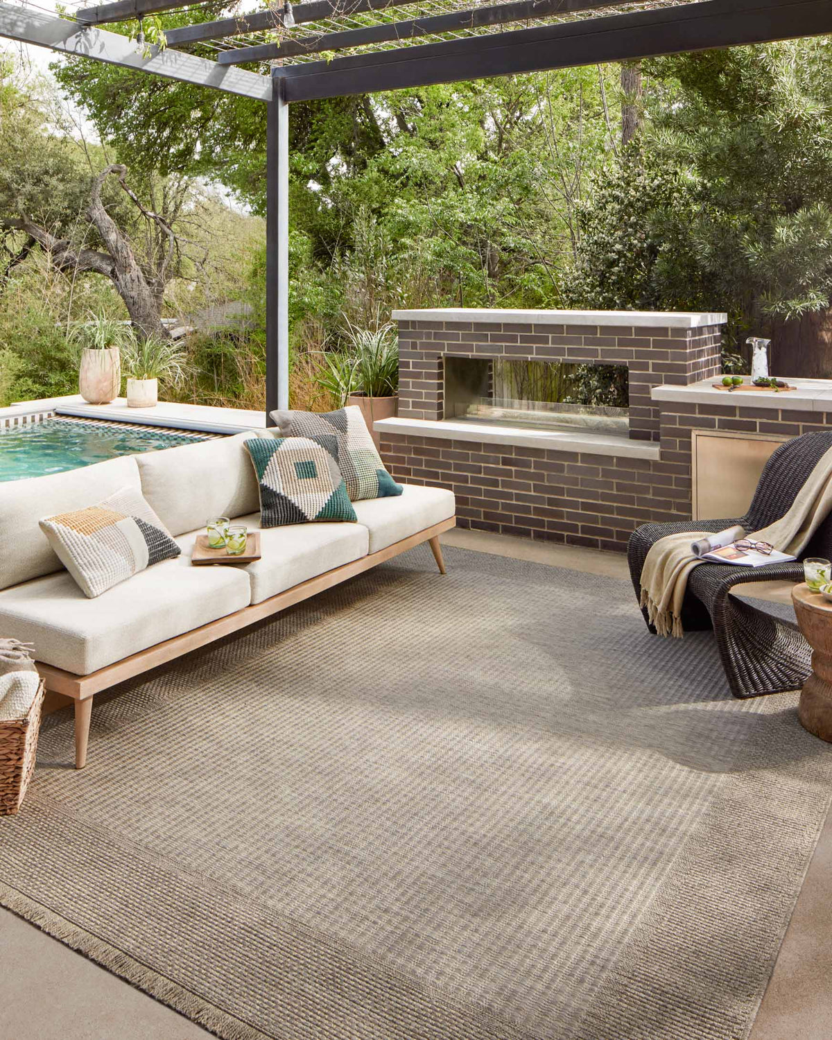 Natural area rug in layered grid pattern with short fringe border, neutral beige and cream