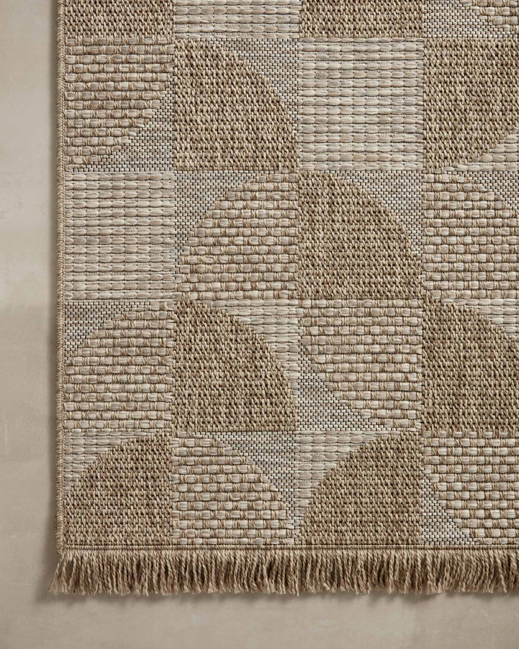 Natural runner rug patchwork pattern with raised texture and short fringe on border