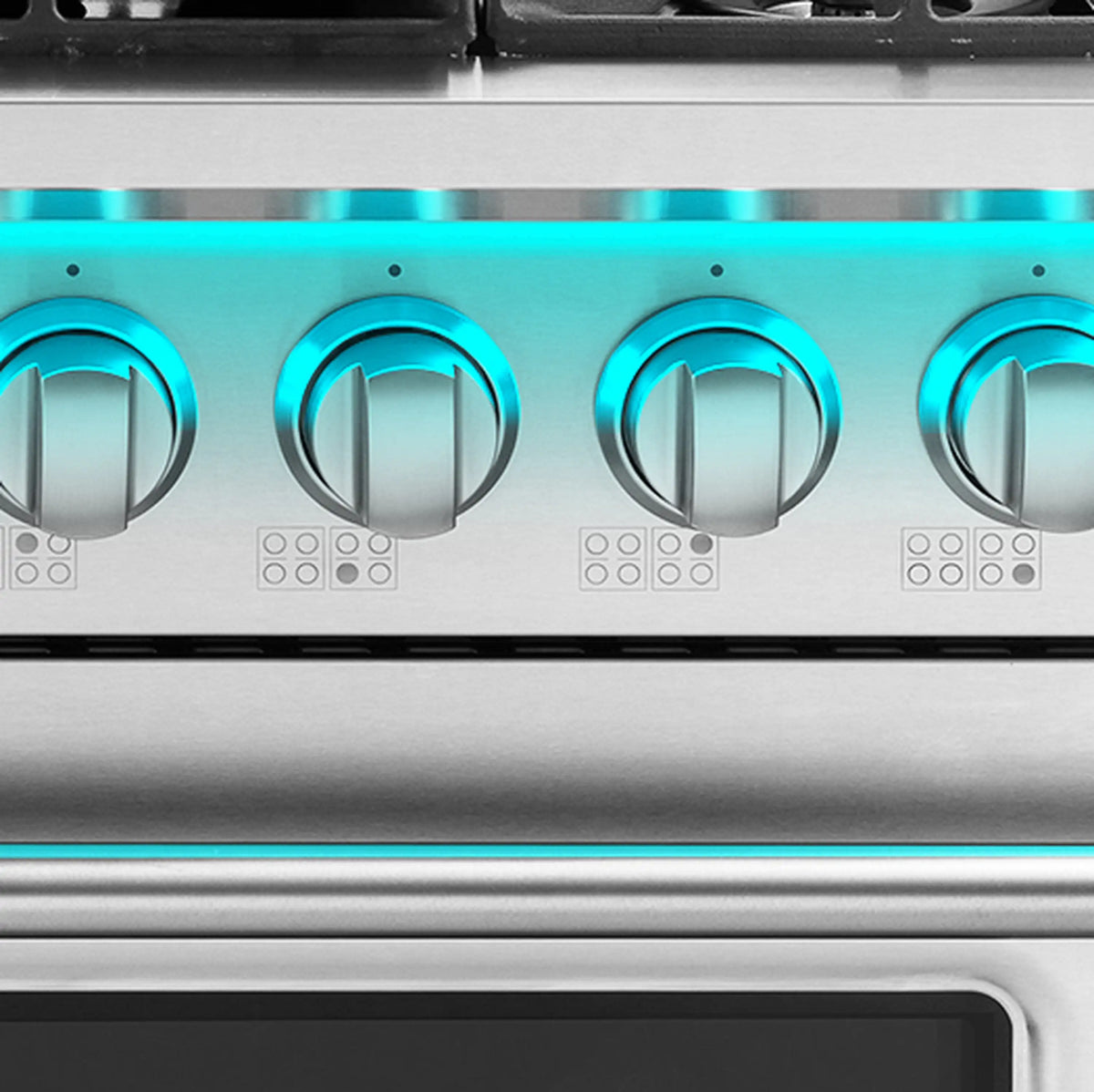 Dual fuel range control panel close-up with blue-lit knobs