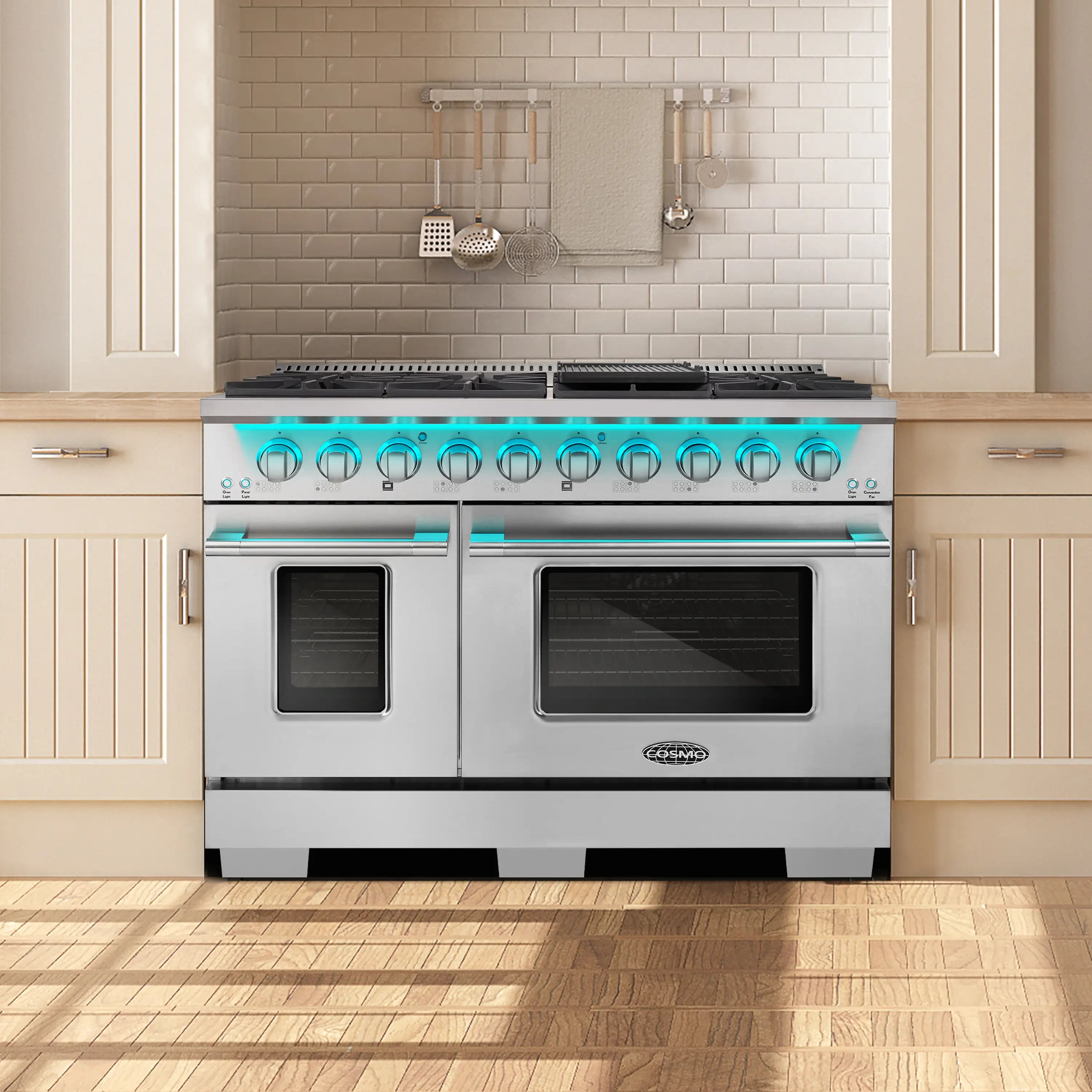 Stainless steel dual fuel range with dual ovens, black burner grates, and control panel