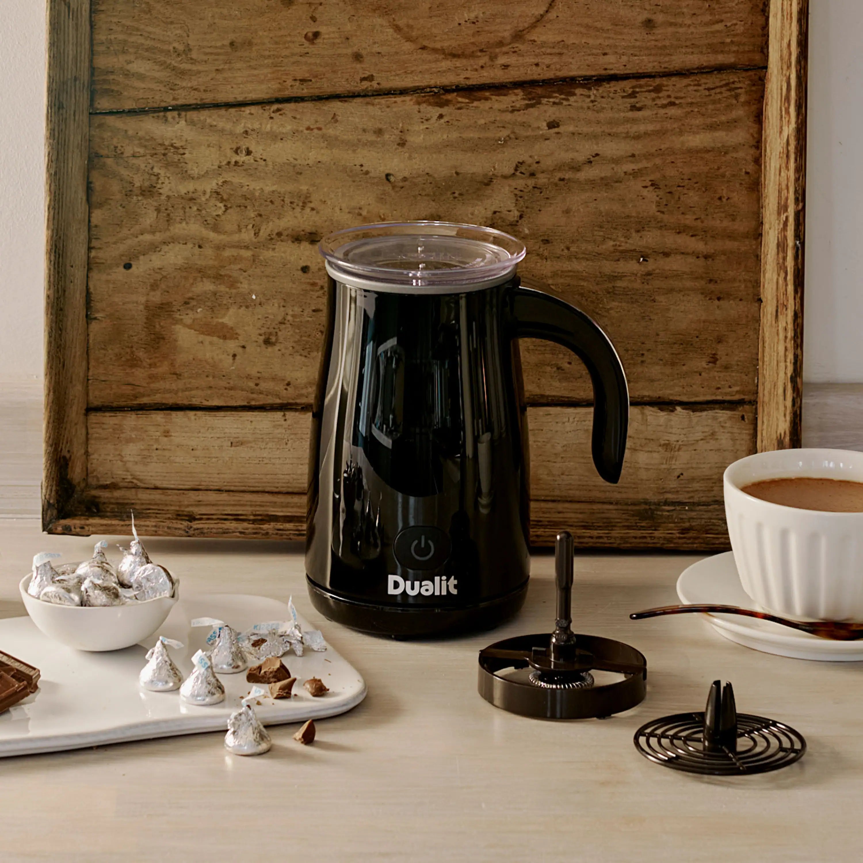 Black Dualit hot chocolate maker with frother attachment and milk jar lid