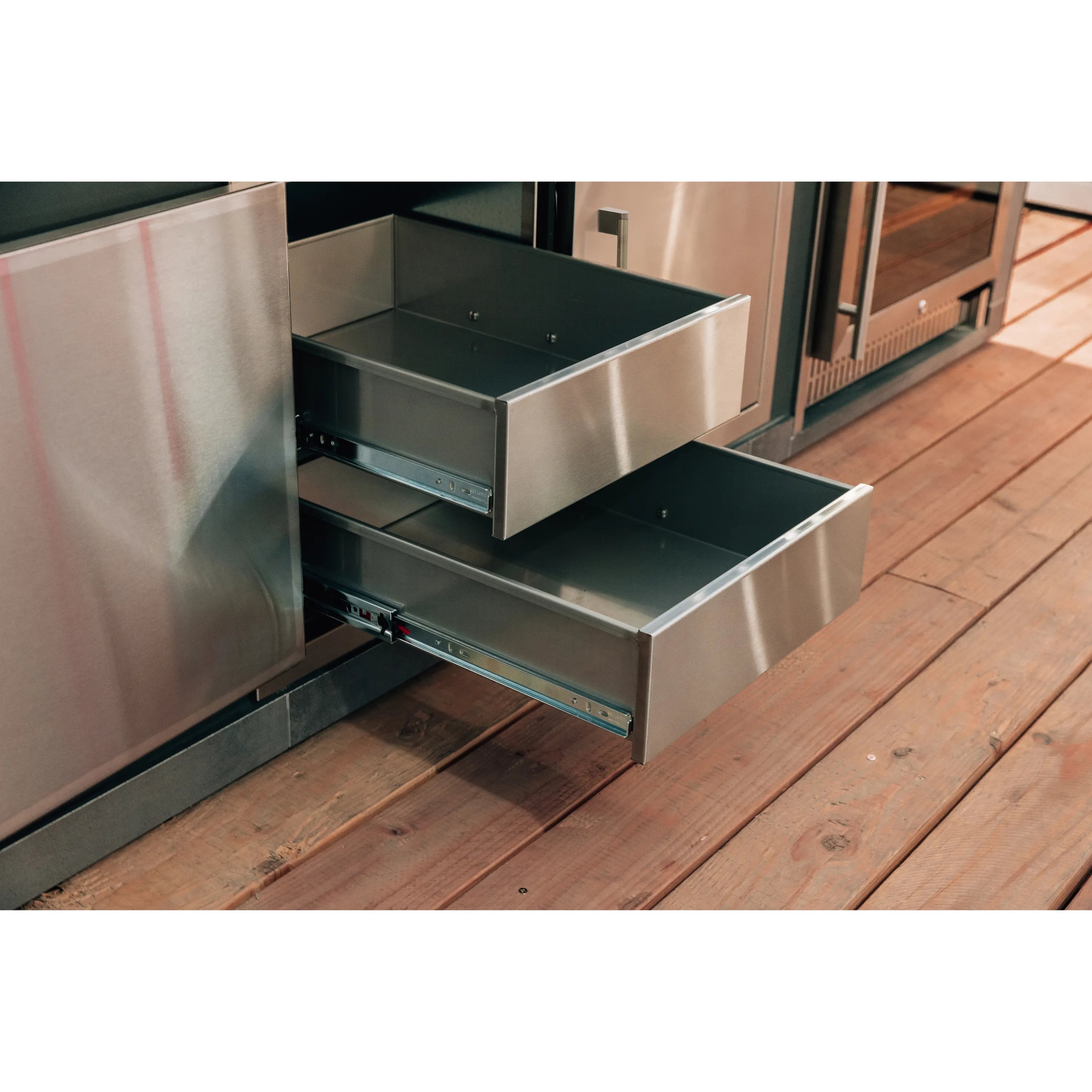 Stainless steel pantry with two pull-out drawers open for dry storage access
