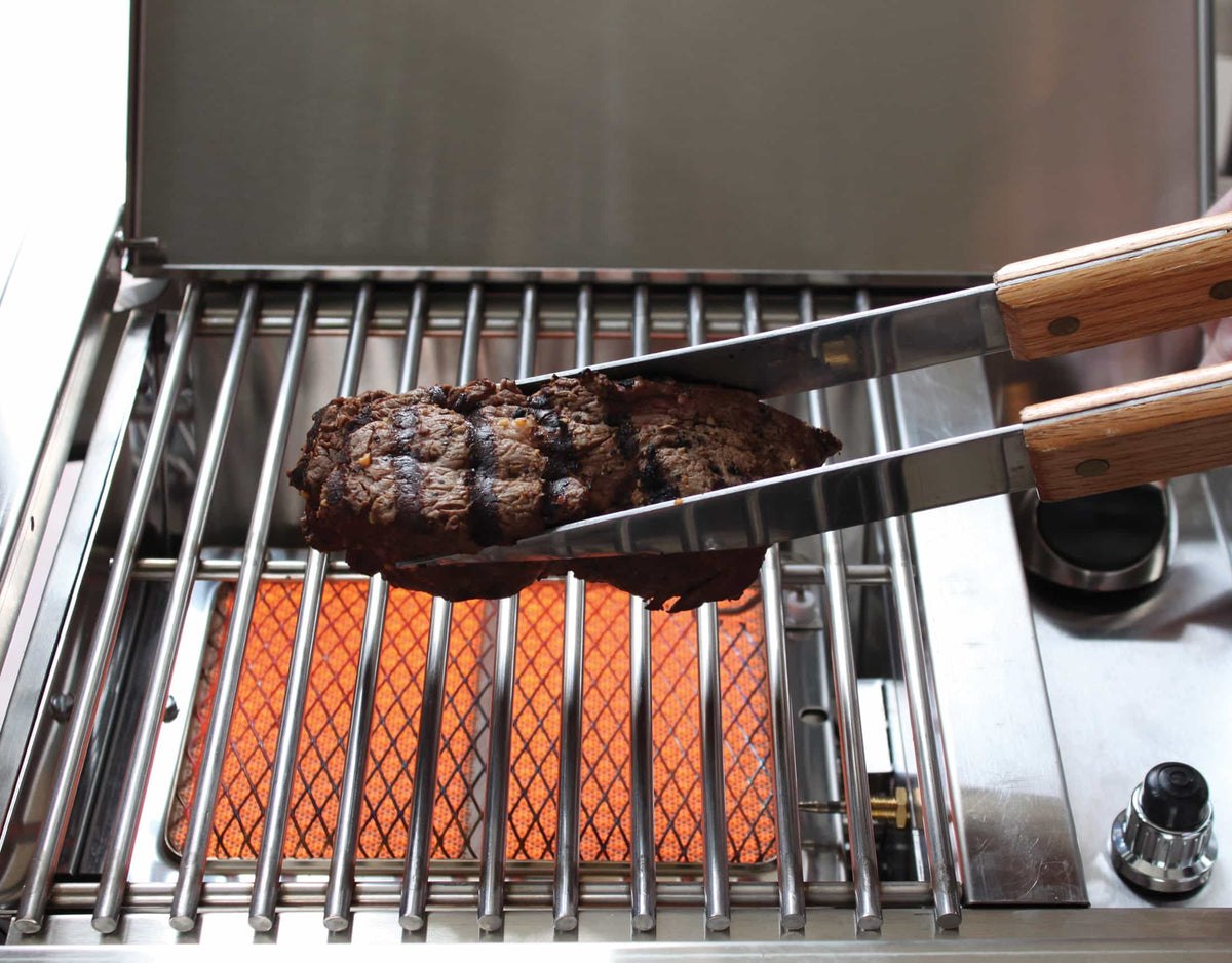Infrared side burner grate with orange flame and cooking surface, stainless steel frame