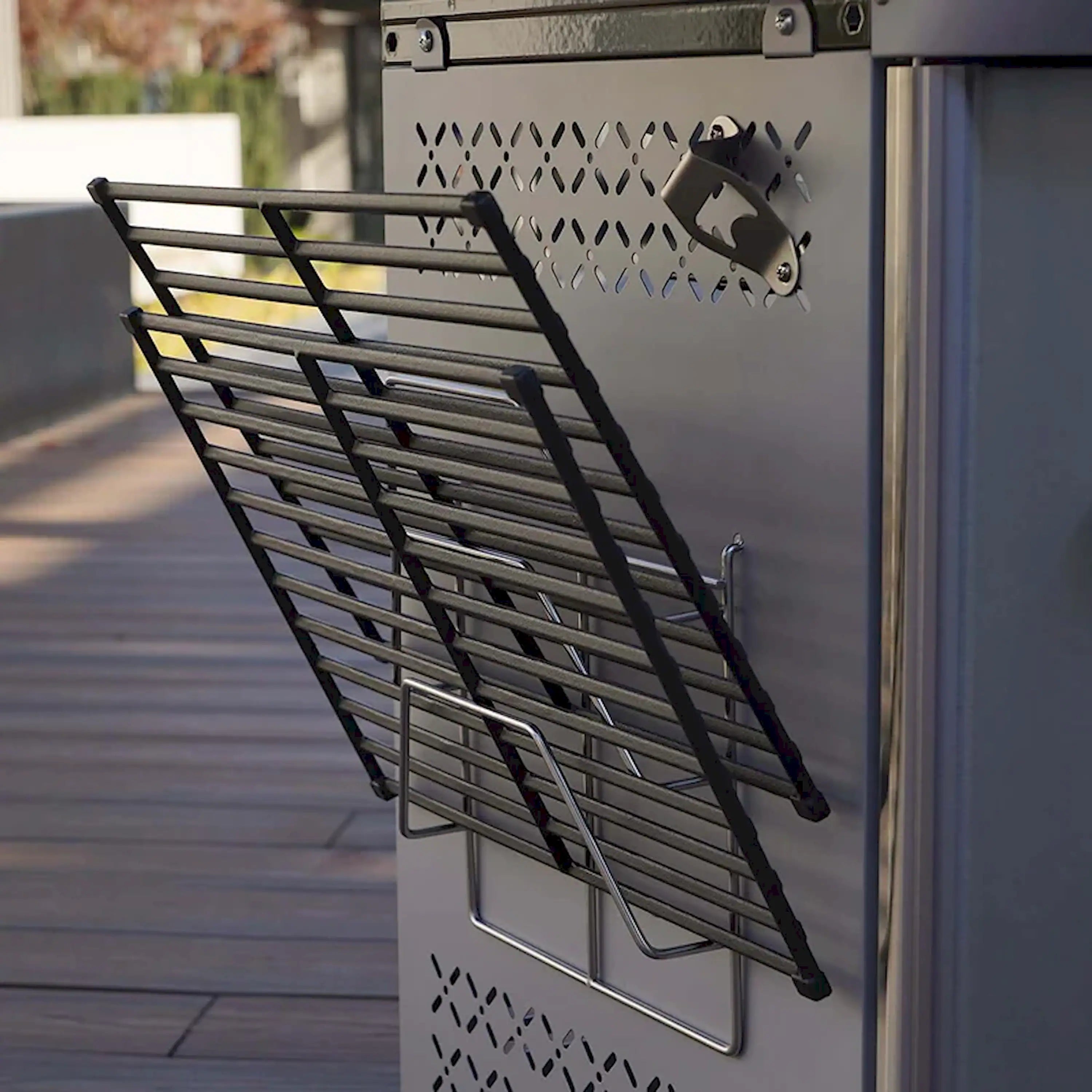 Black slatted grill rack panel with side handles and hanging hooks