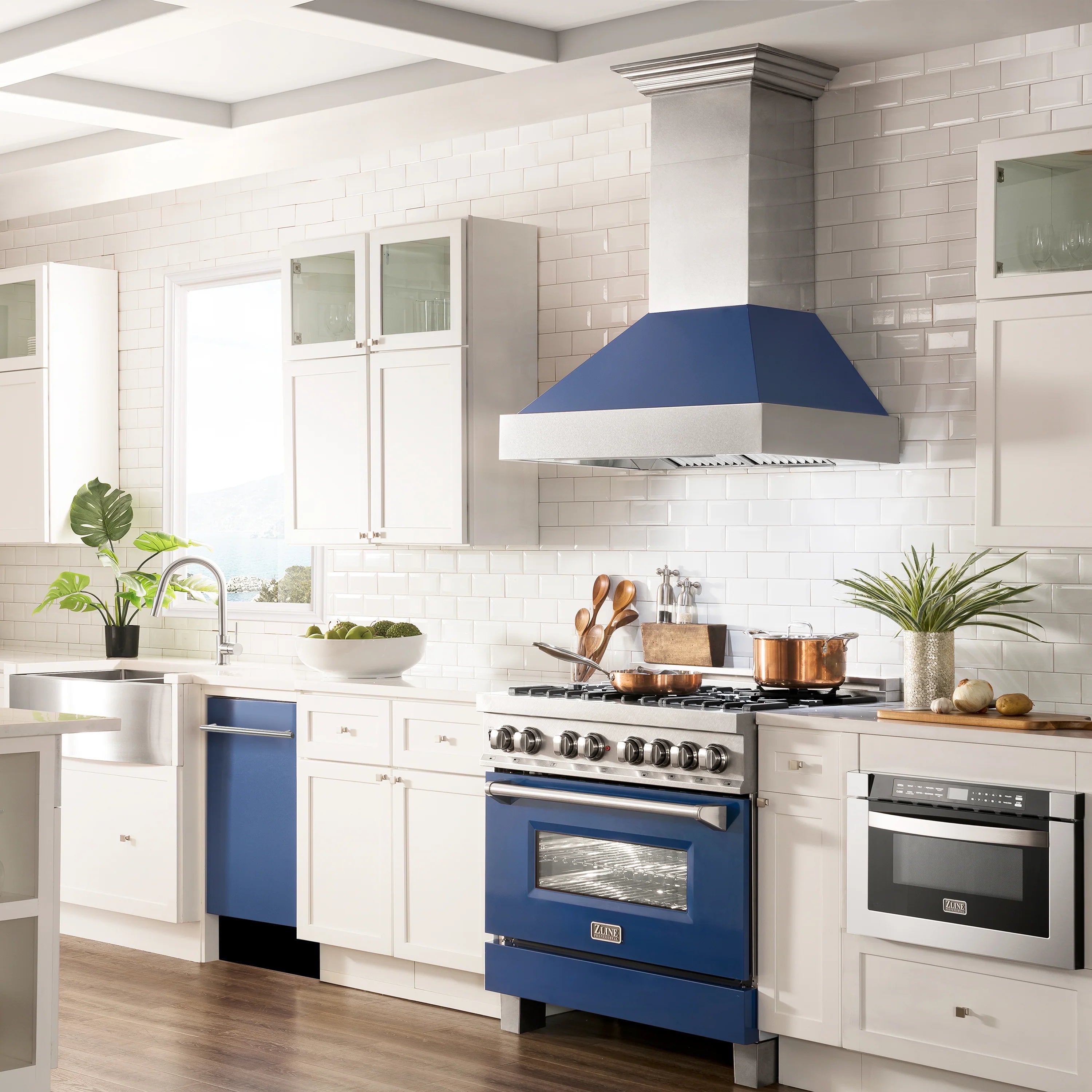 Blue matte dishwasher installed in modern kitchen with stainless accents
