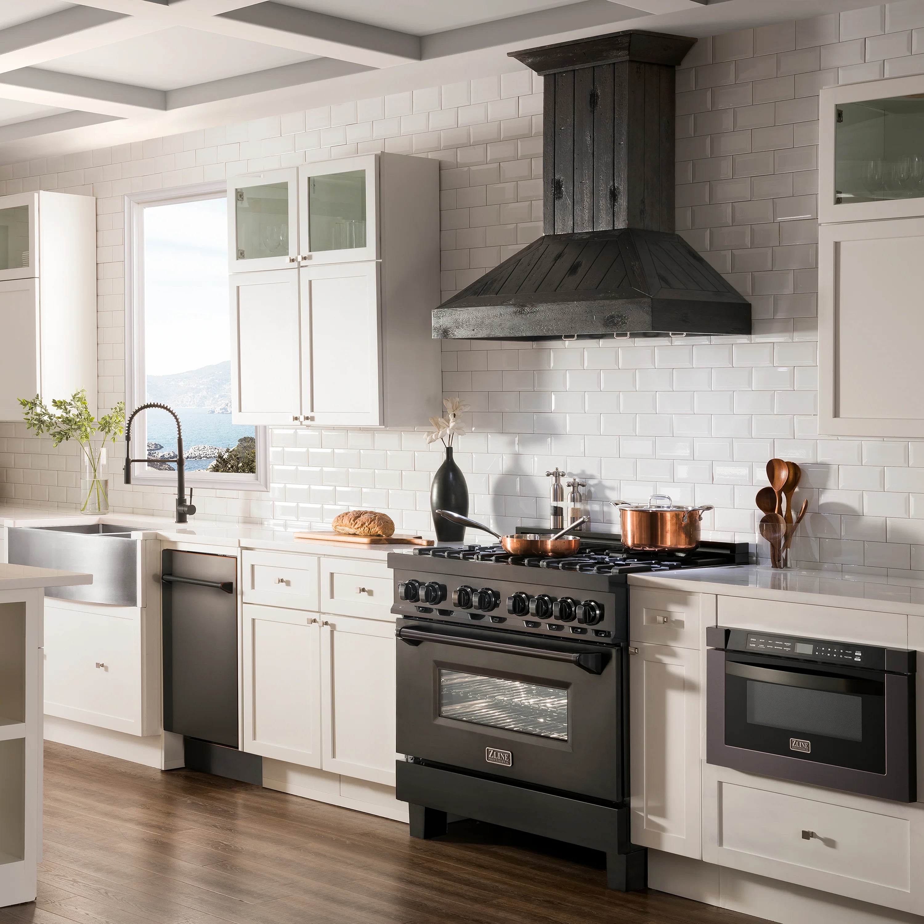 Built-in dishwasher in stainless and dark cabinet setting in a modern kitchen