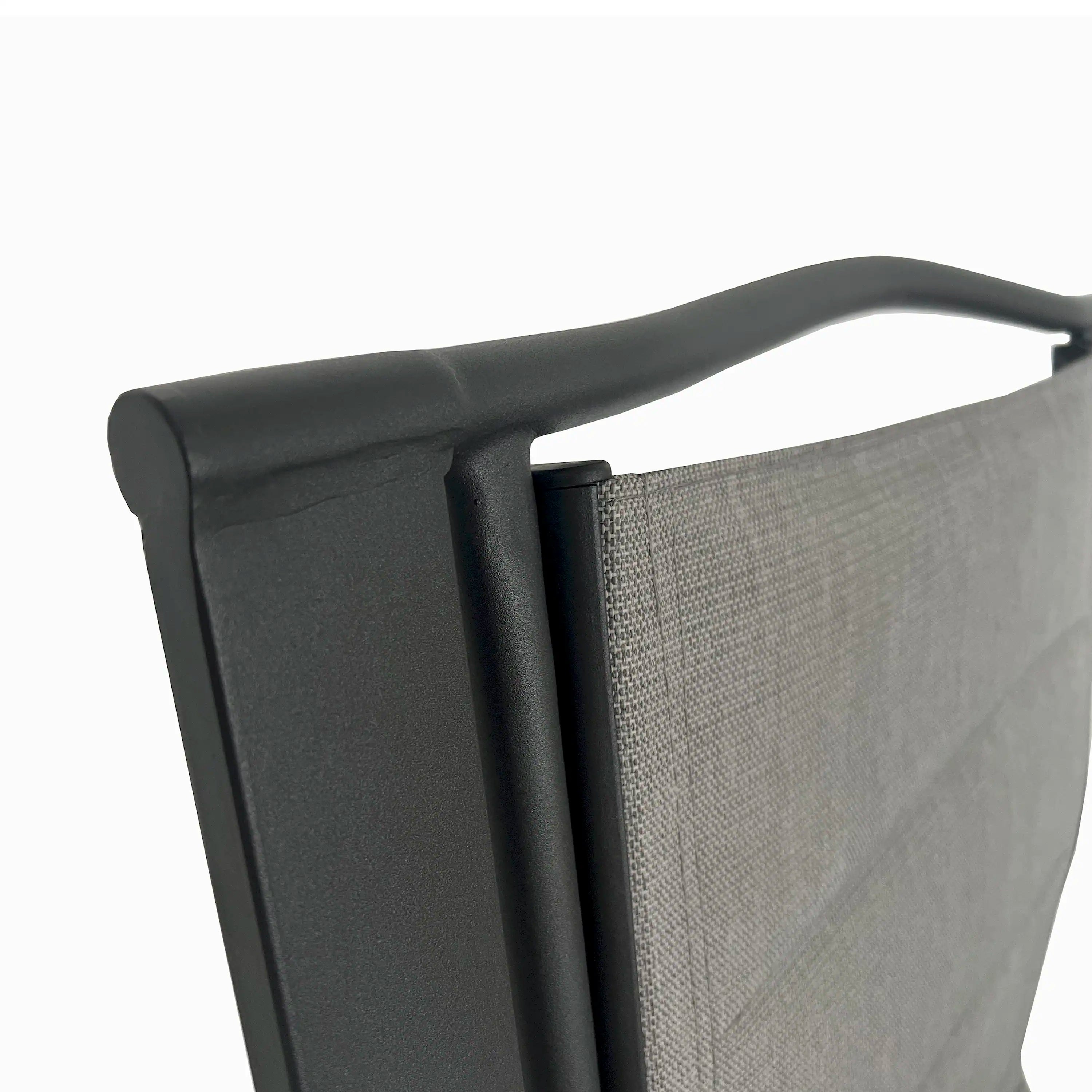 Patio chair black armrest and back frame support detail.