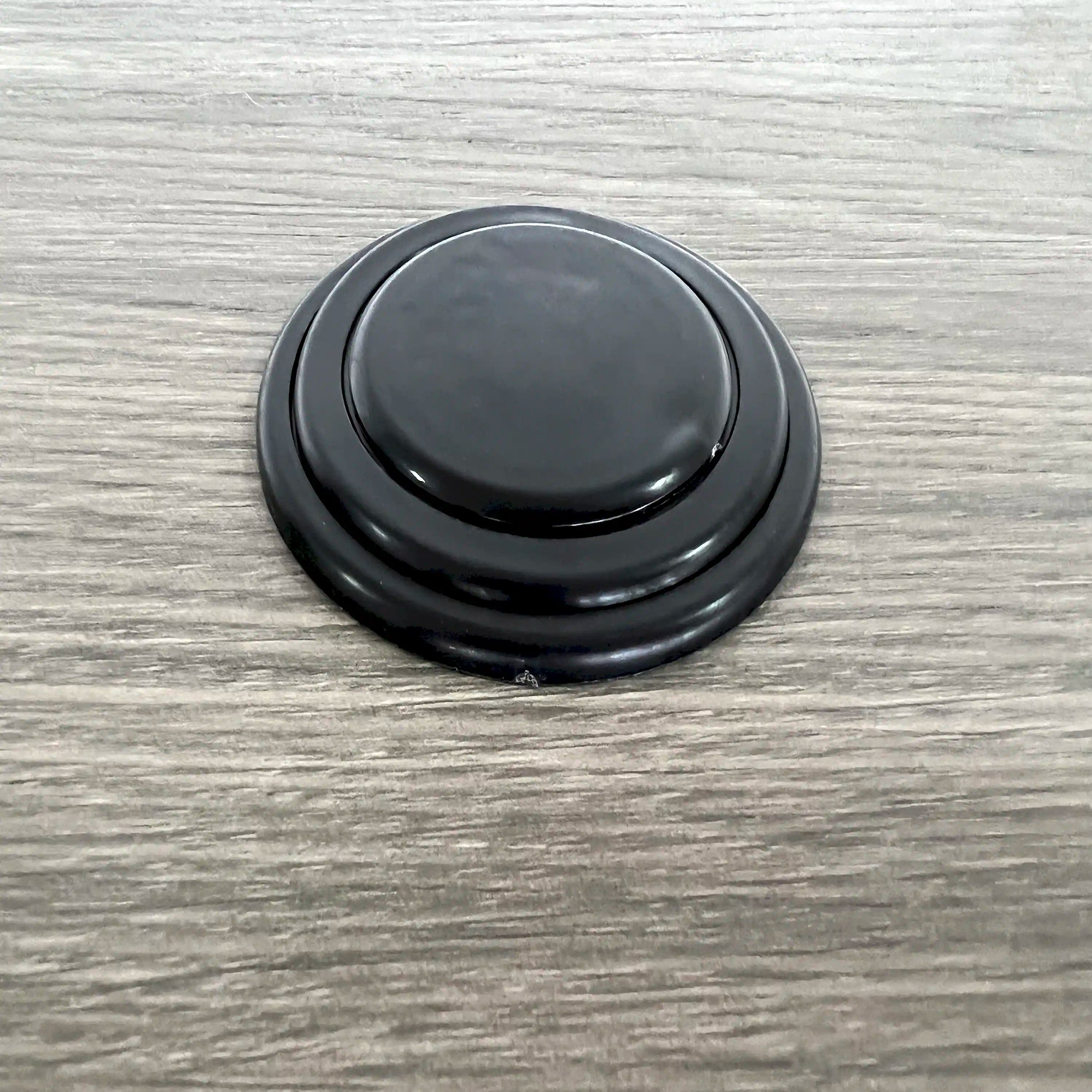 Round outdoor table top with dark rim and smooth, flat surface