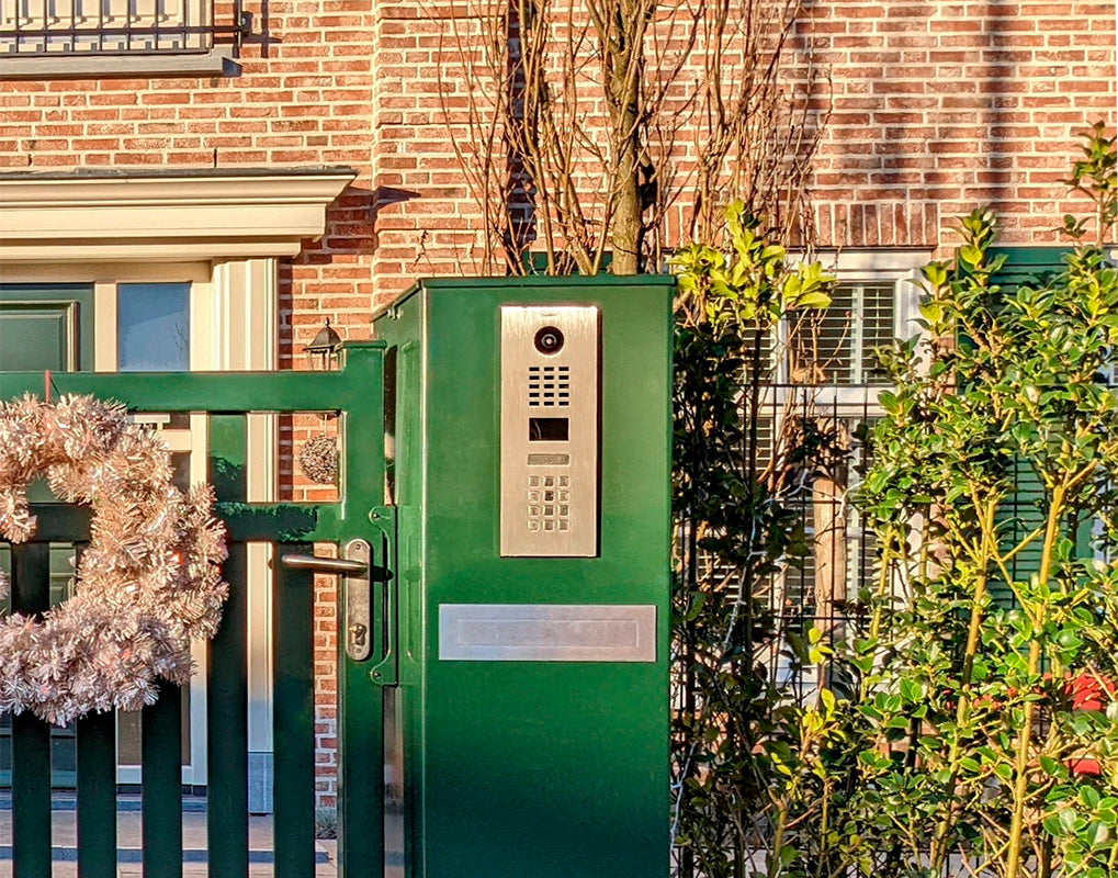 DoorBird IP video intercom panel in nut brown with camera and keypad