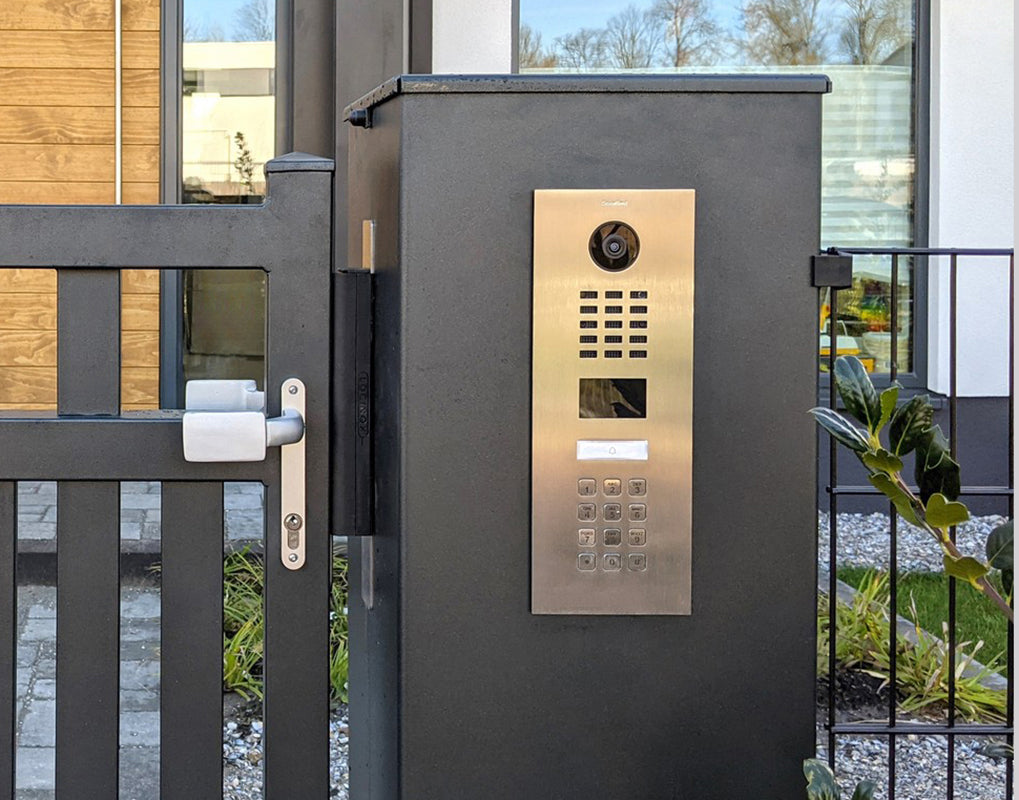 DoorBird IP video door intercom panel with camera lens and keypad buttons