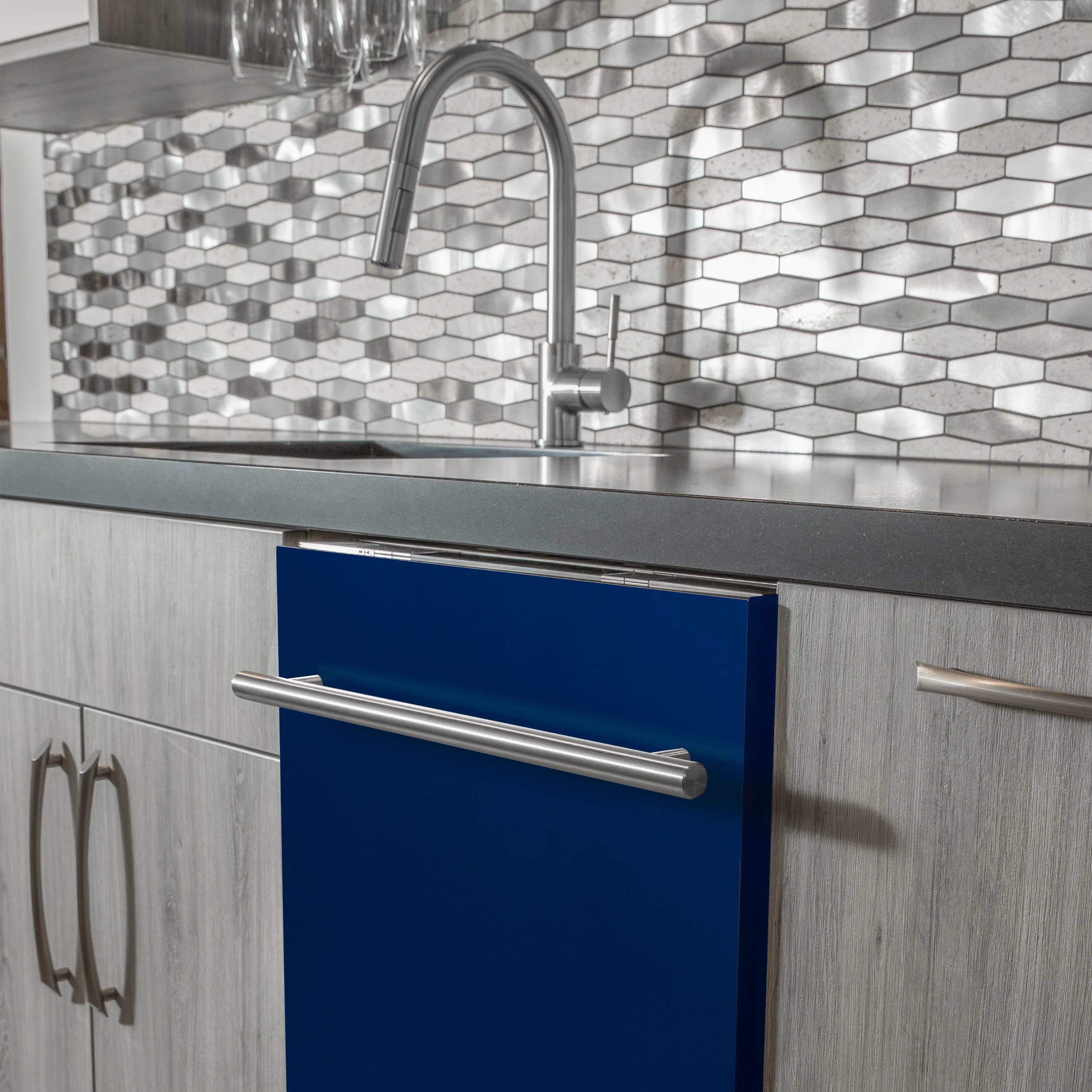 Built-in blue gloss dishwasher door with stainless steel handle near backsplash