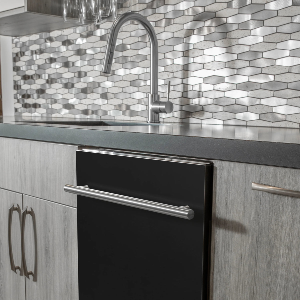 Built-in black matte dishwasher door with stainless handle in kitchen setting